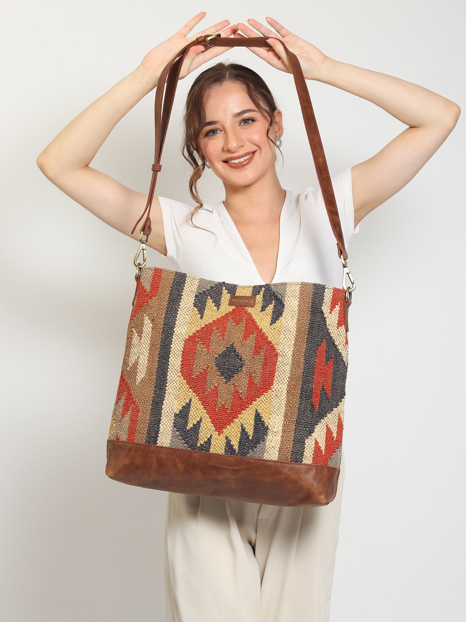 Austere kilim and leather handbag, side view — Art Avenue