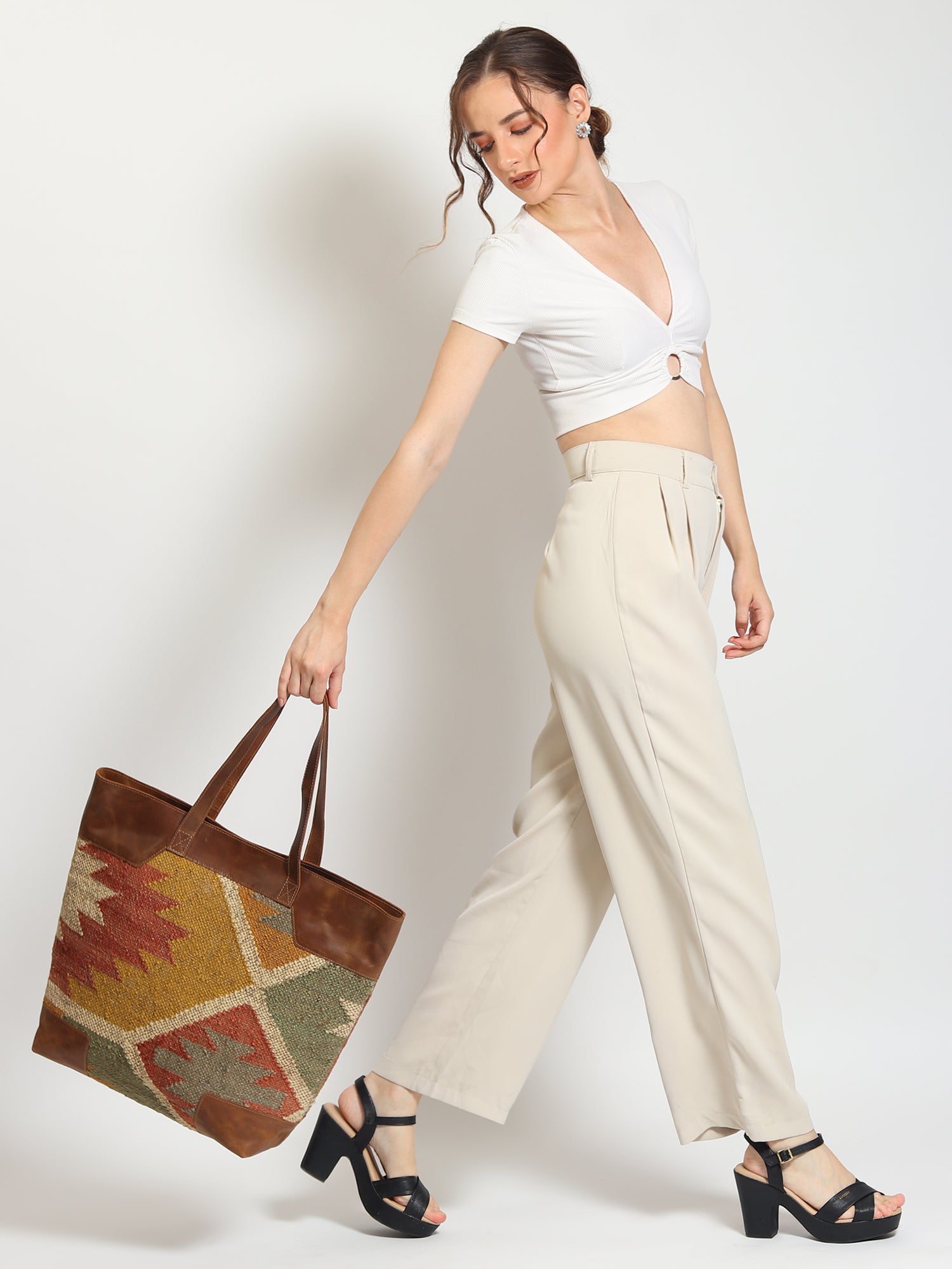 Nahua kilim and leather handbag, side view — Art Avenue