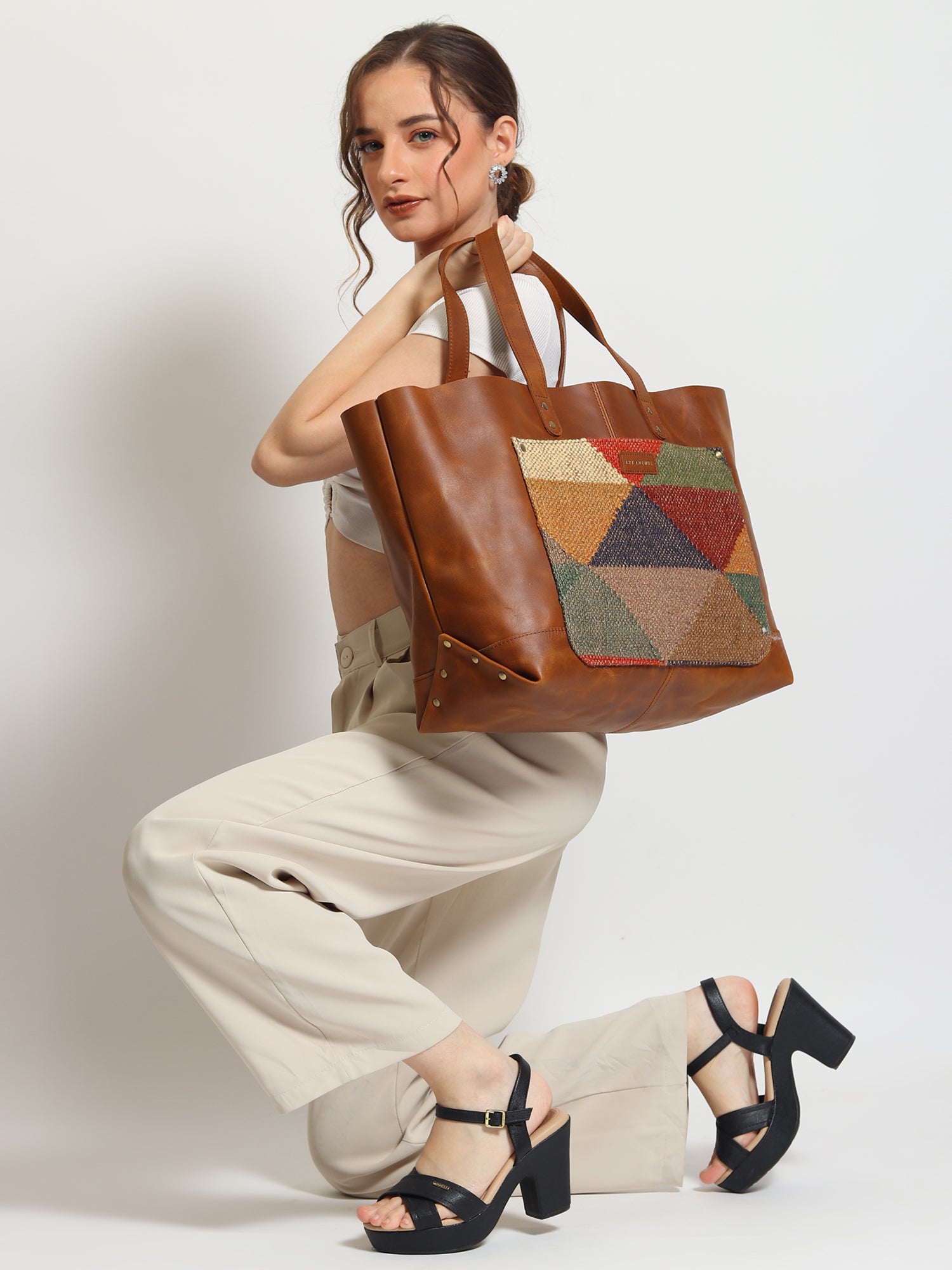 Sarah kilim and leather handbag, side view — Art Avenue