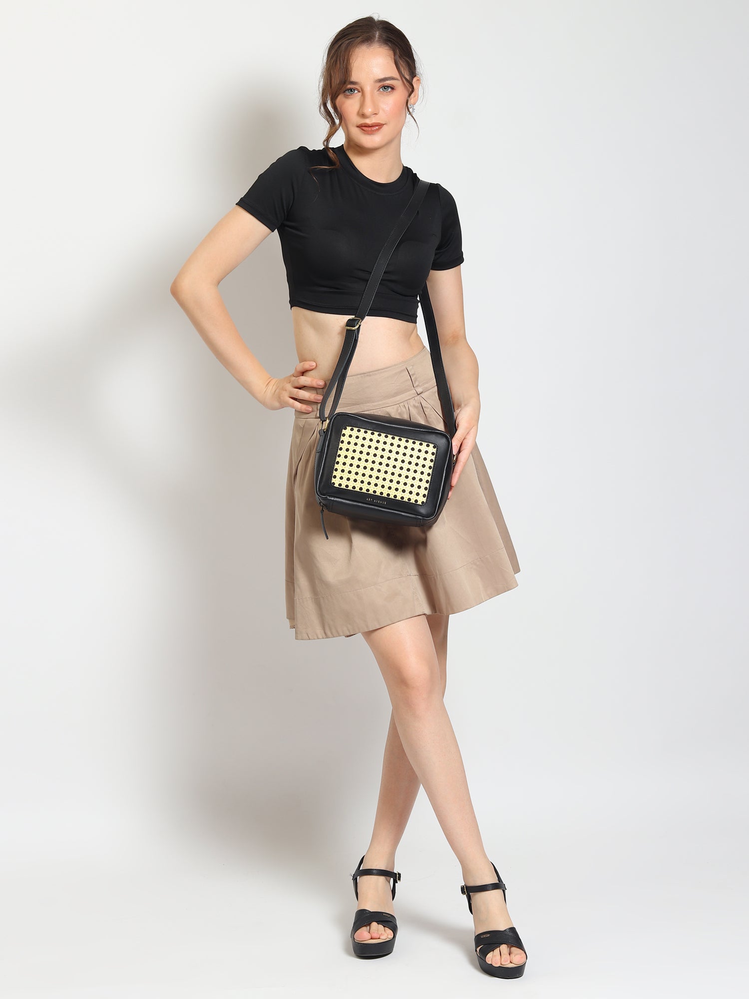 Laremy cane and leather sling bag closure detail — Art Avenue