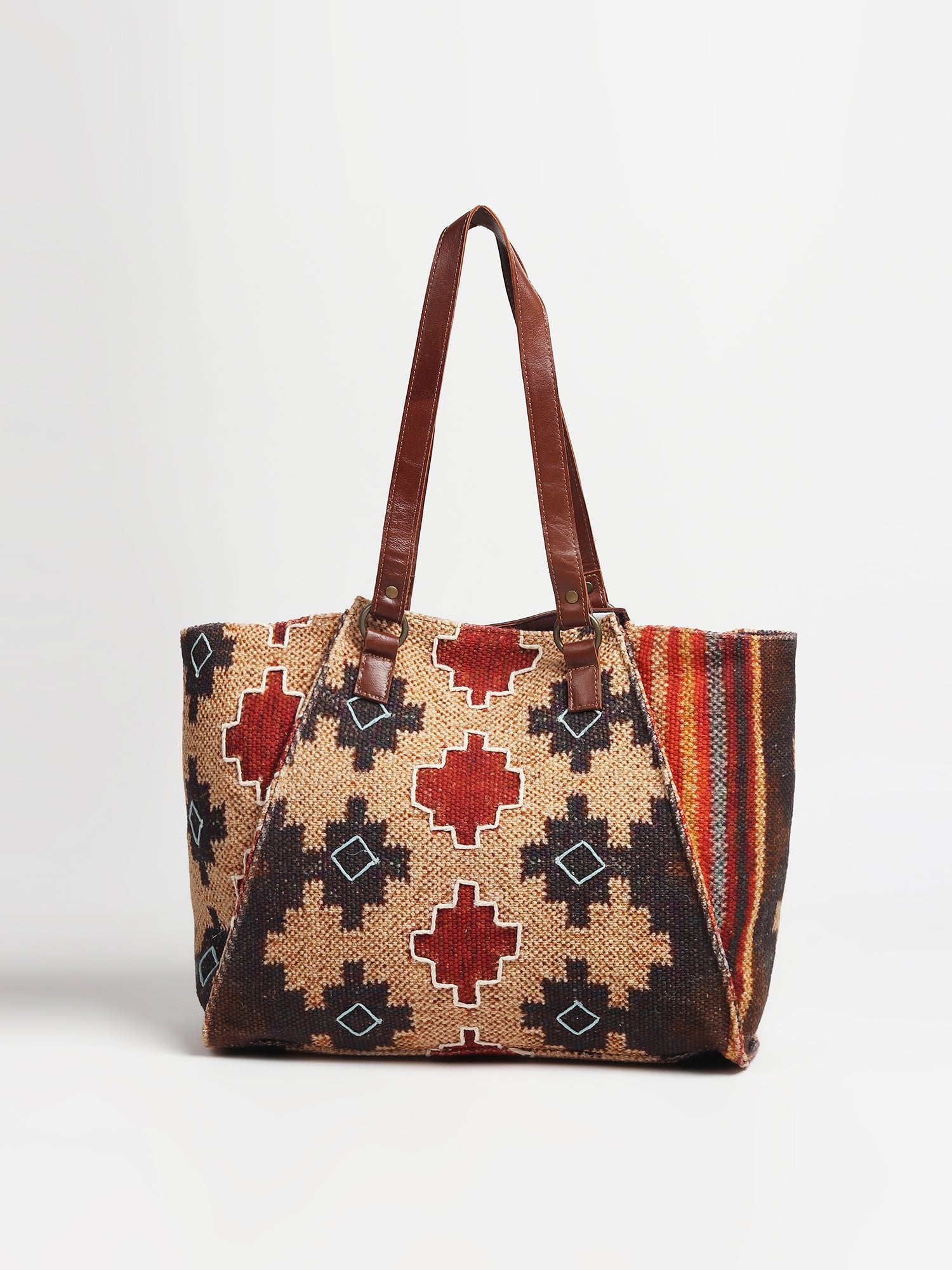 Zemin printed kilim and leather handbag lifestyle — Art Avenue