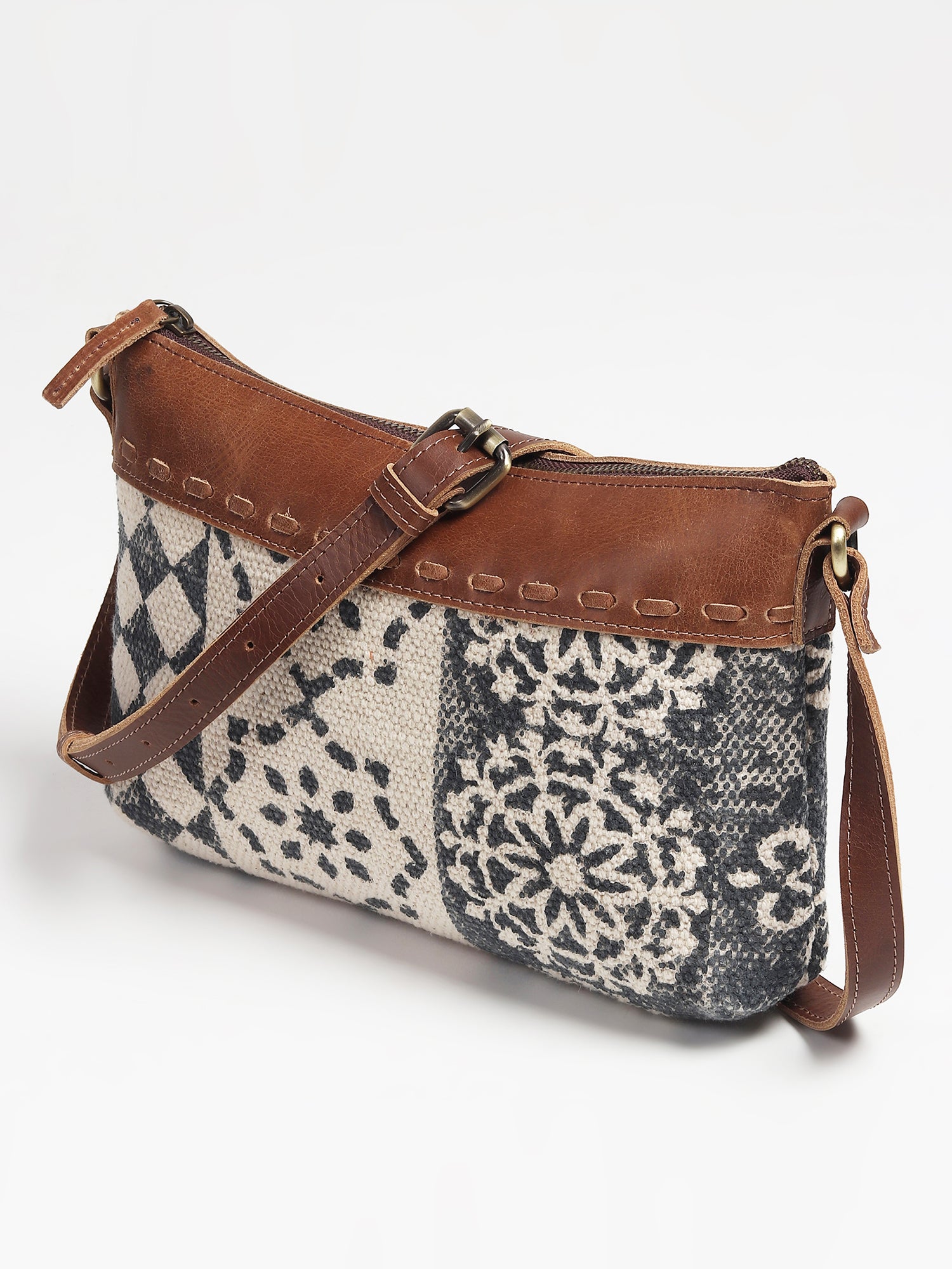 Charlotte leather sling bag, side view — Art Avenue