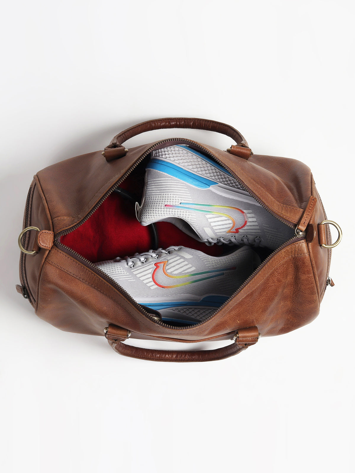 Aviator leather duffle bag flat lay — Art Avenue