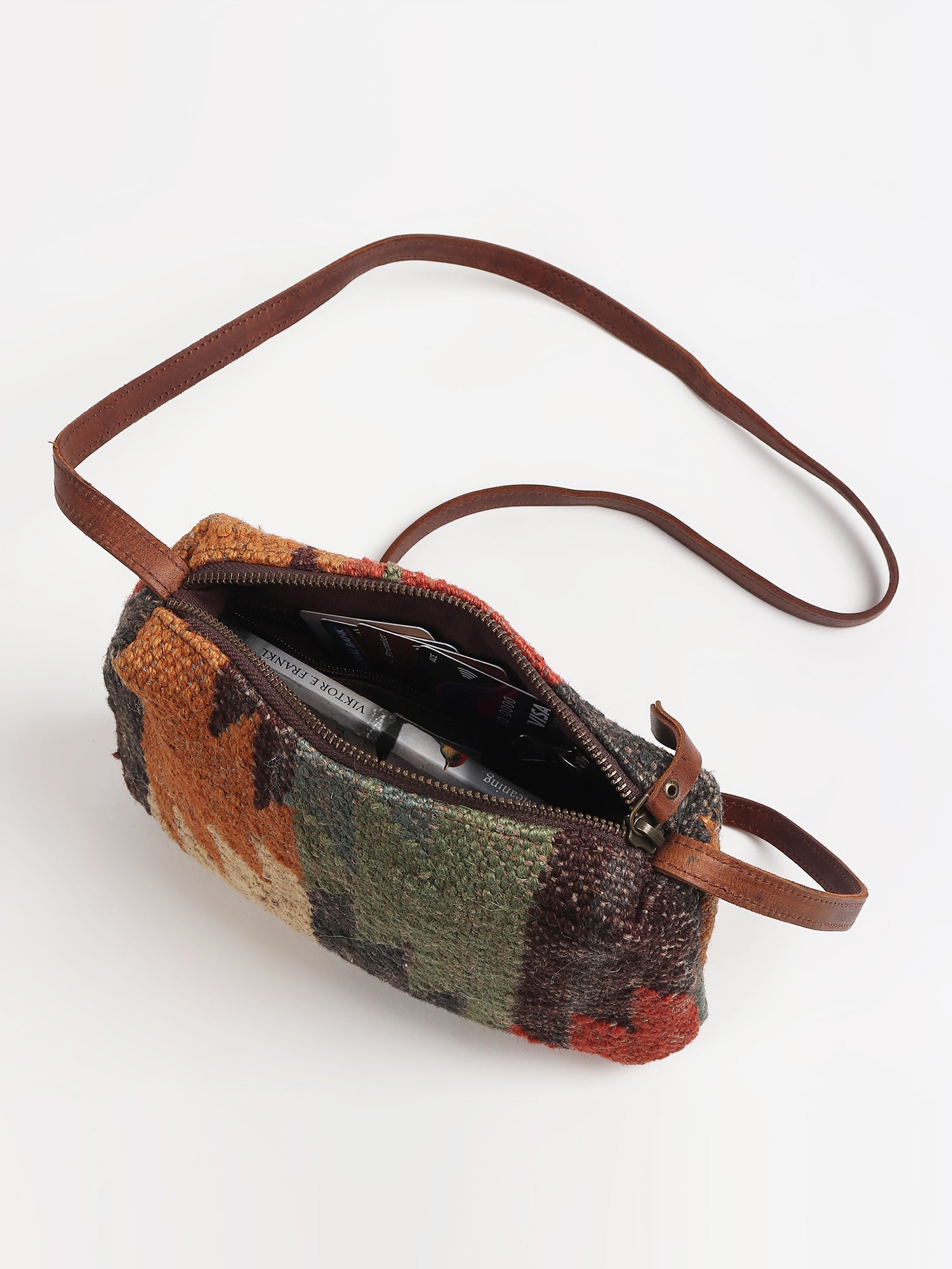 Alpha leather sling bag side detail — Art Avenue