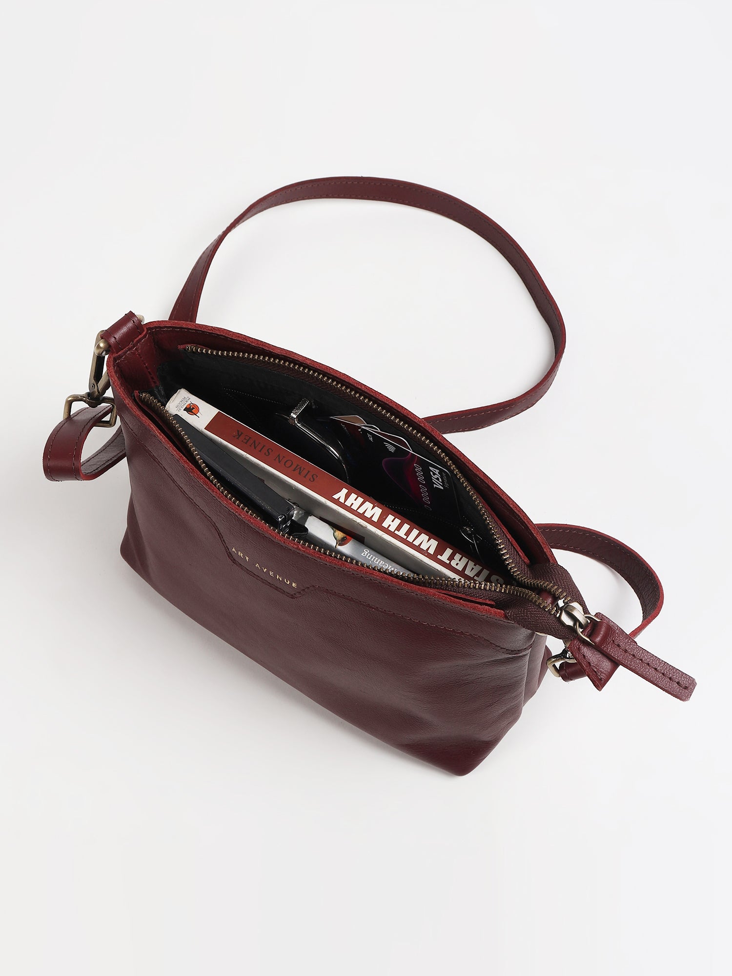 Ladislao leather sling bag on model — Art Avenue
