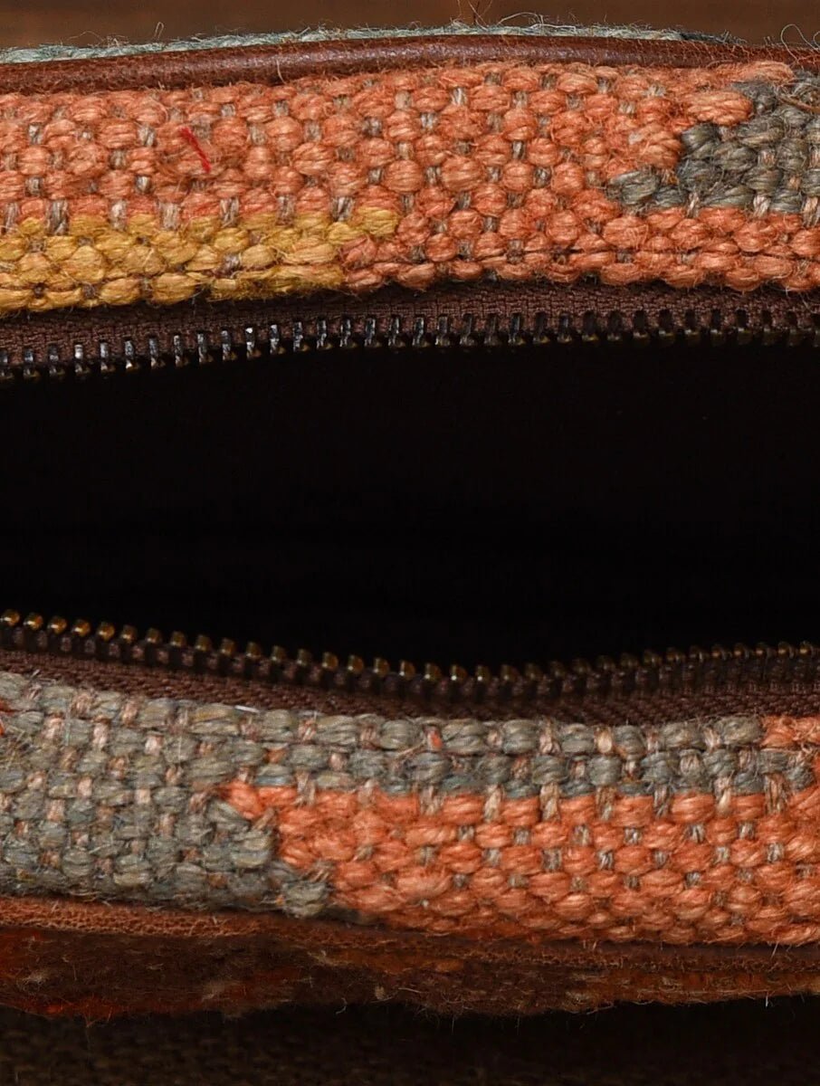 Jolly kilim and leather sling bag flat lay — Art Avenue
