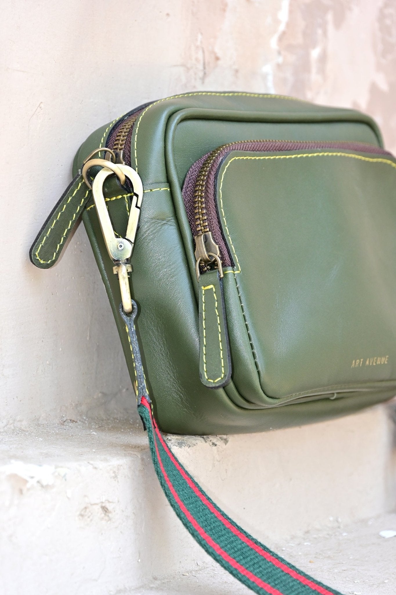 Harisson green sling bag side view — Art Avenue