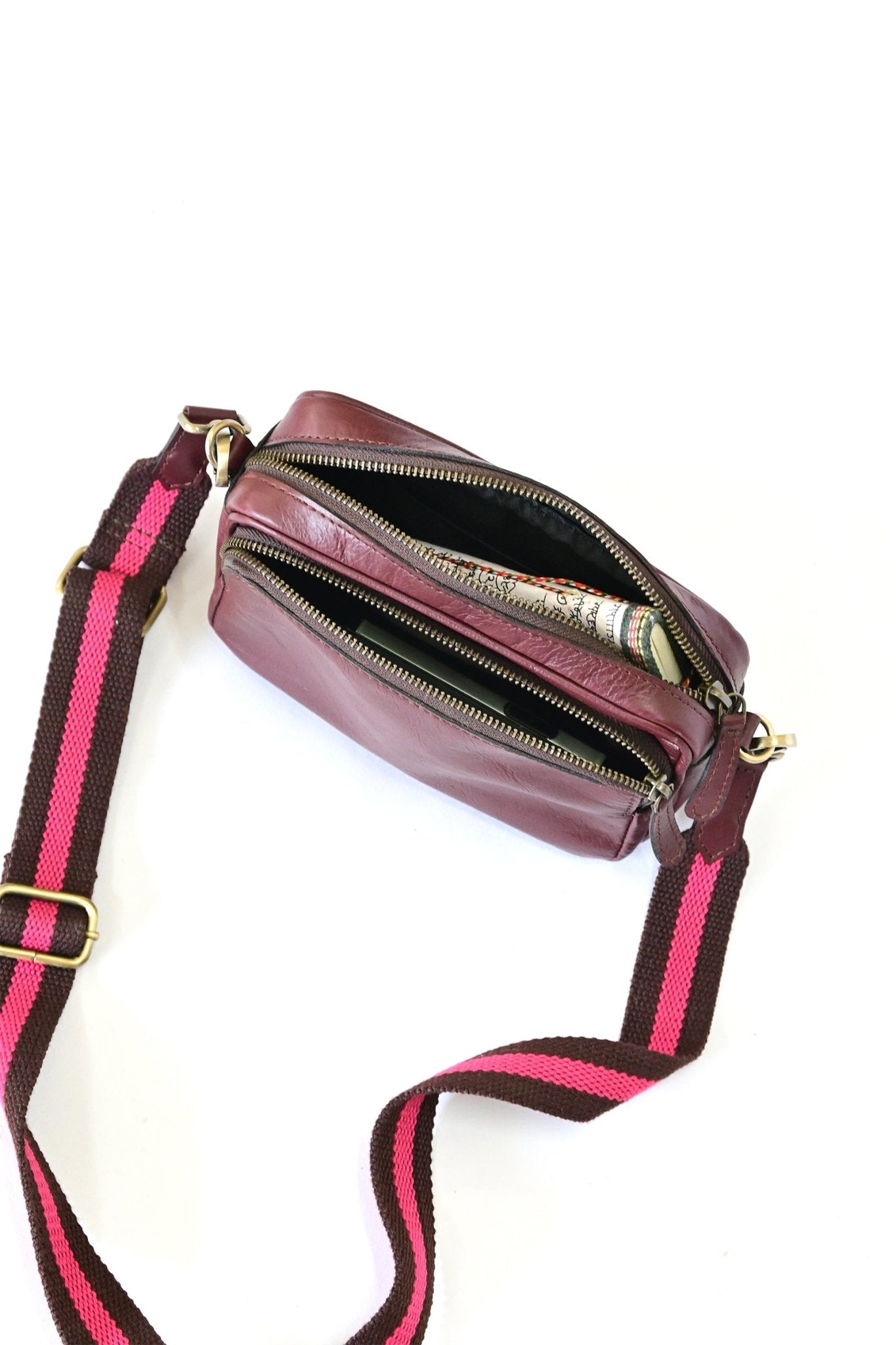 Harisson maroon sling bag on model — Art Avenue