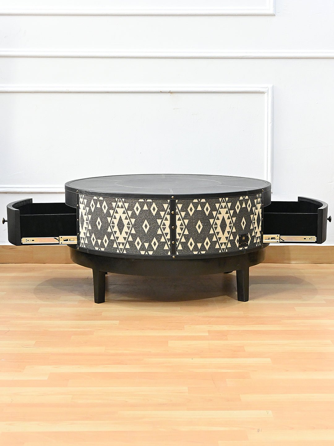 Round coffee table — wooden leg detail — Art Avenue