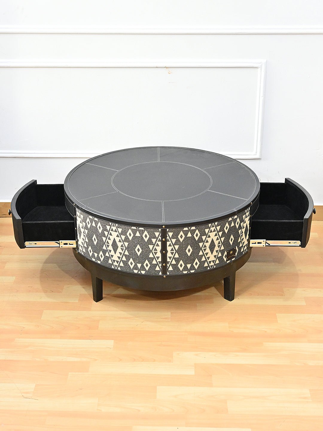 Handcrafted round coffee table — leather and printed cotton — Art Avenue