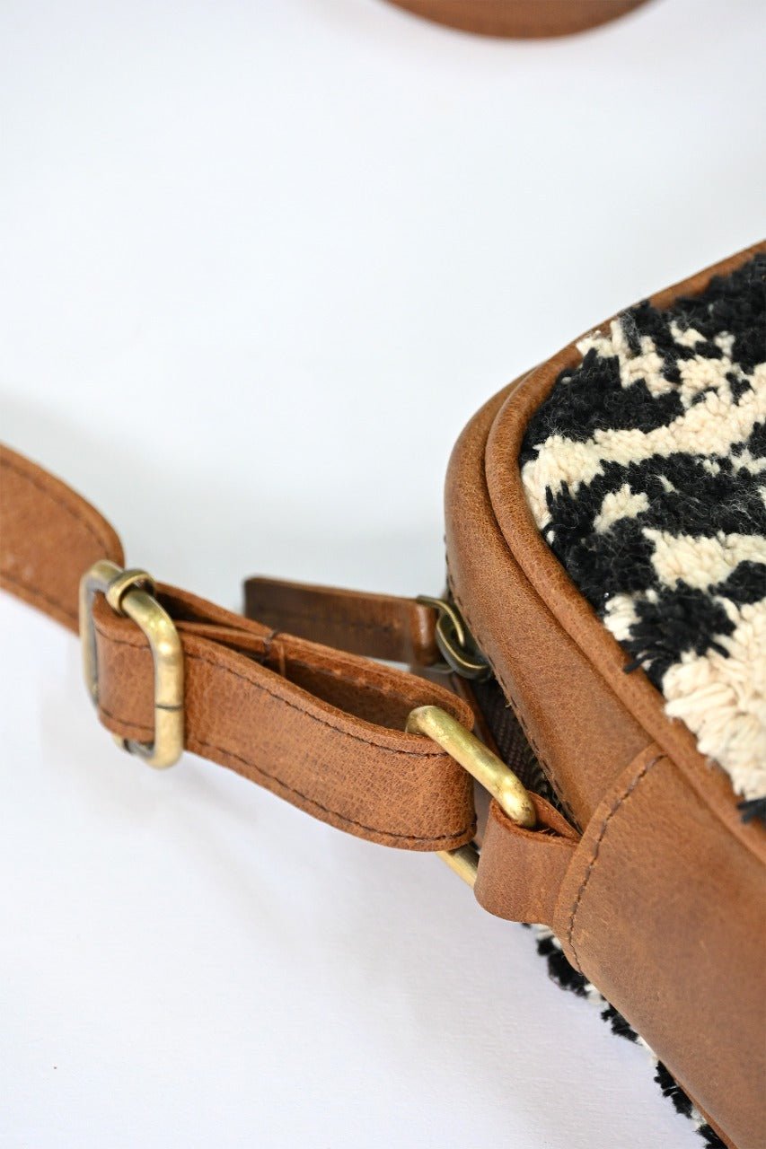Archer leather sling bag flat lay — Art Avenue