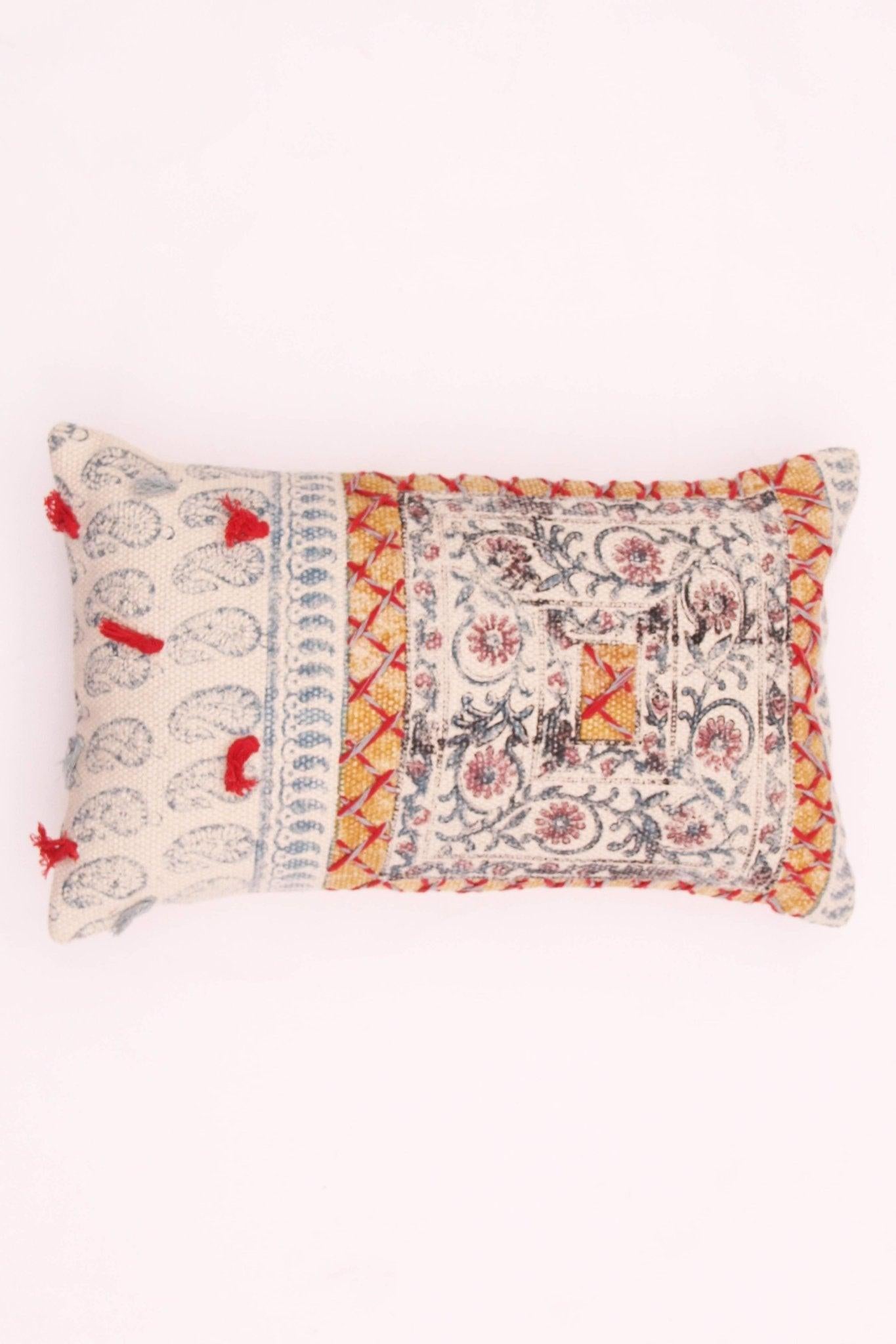 Block-printed embroidered lumbar cushion on sofa — Art Avenue
