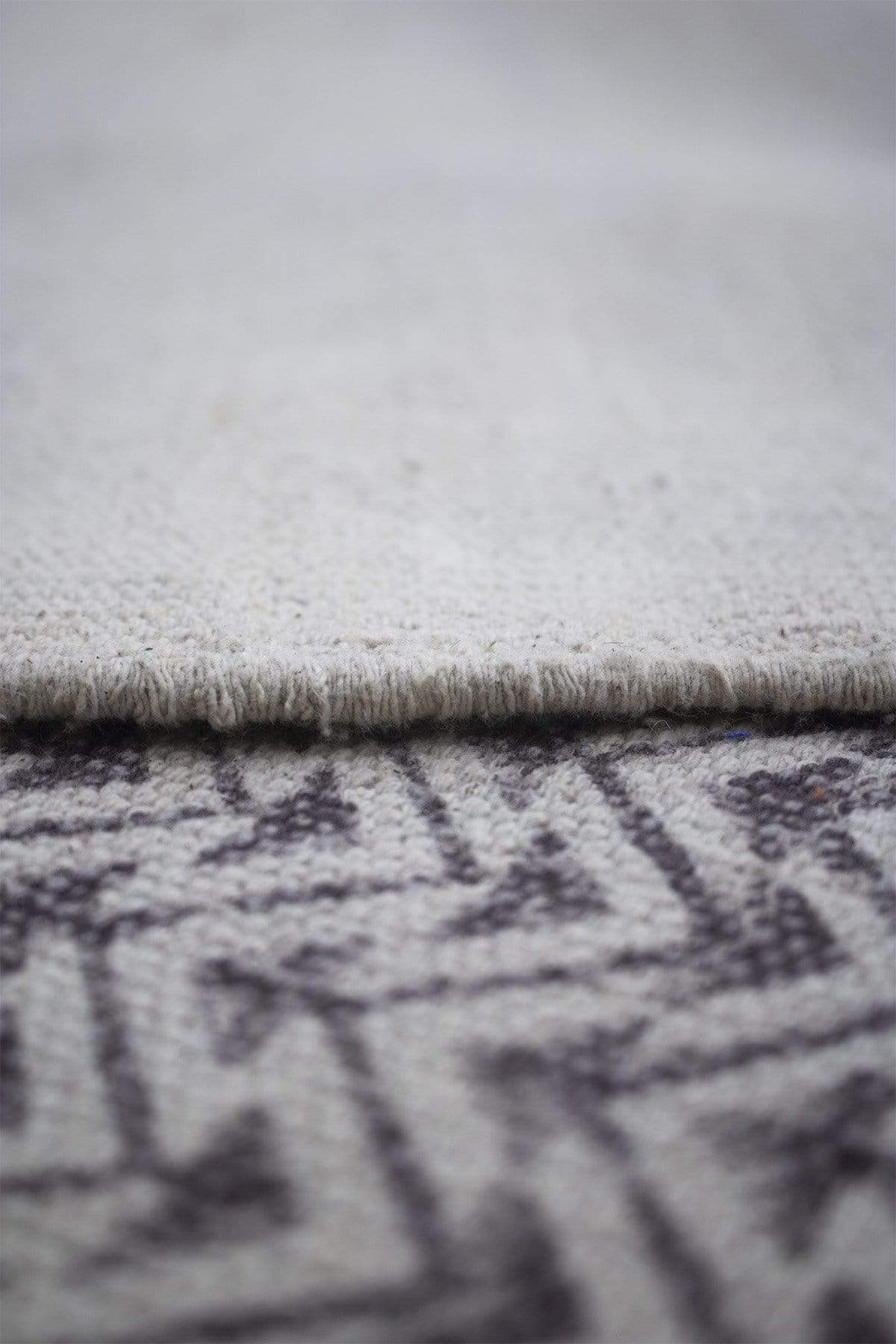 Detail of block-print on brown cotton dhurrie rug — Art Avenue