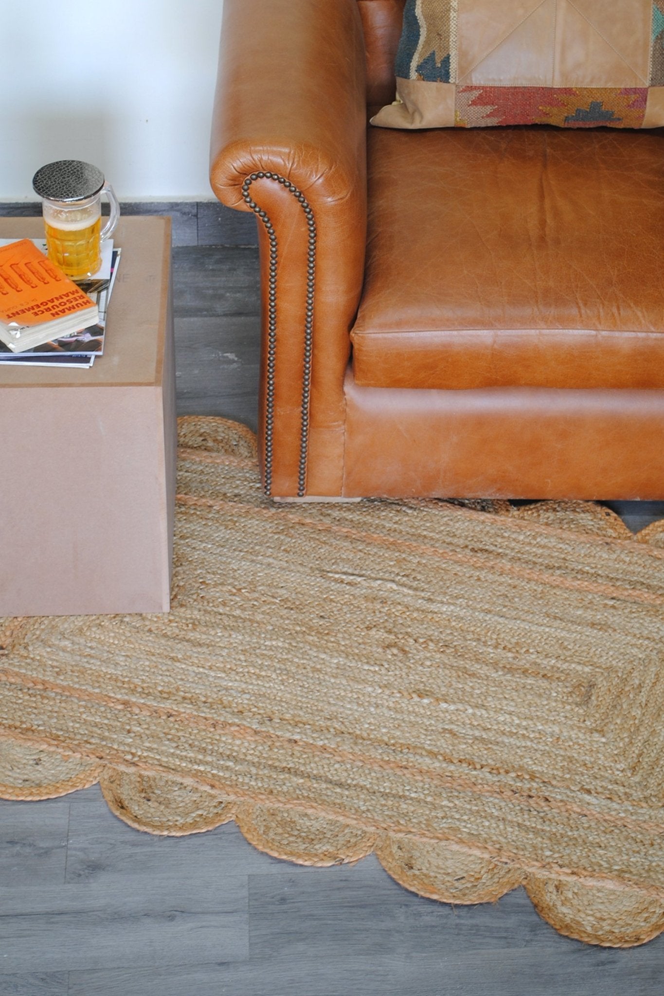 Camrose braided jute rug room setting — Art Avenue
