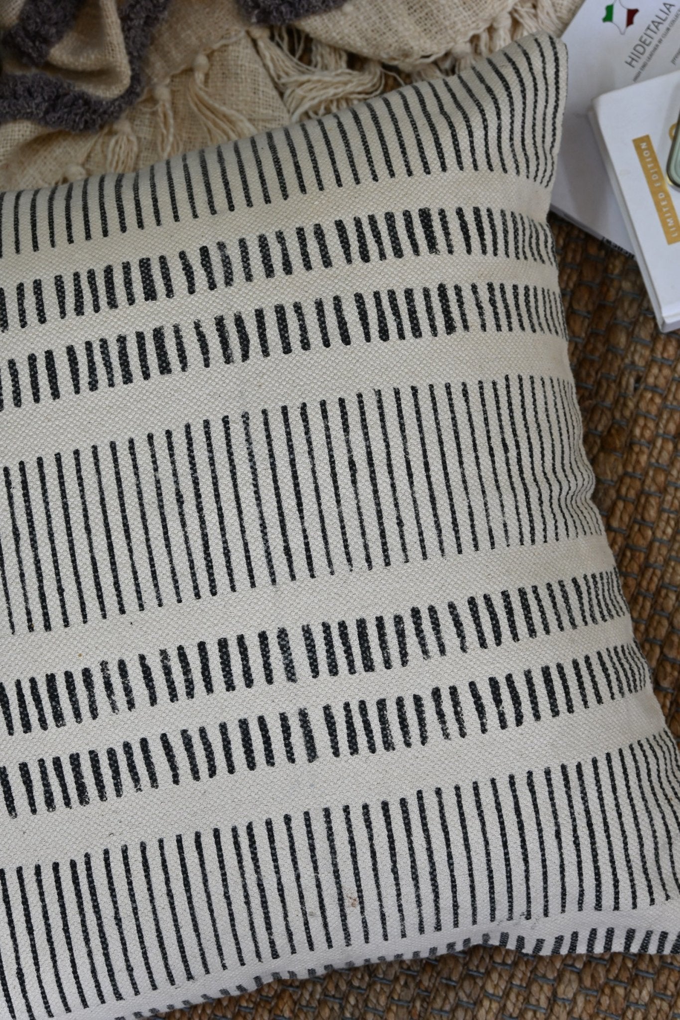 Block-printed square cushion on sofa — Art Avenue