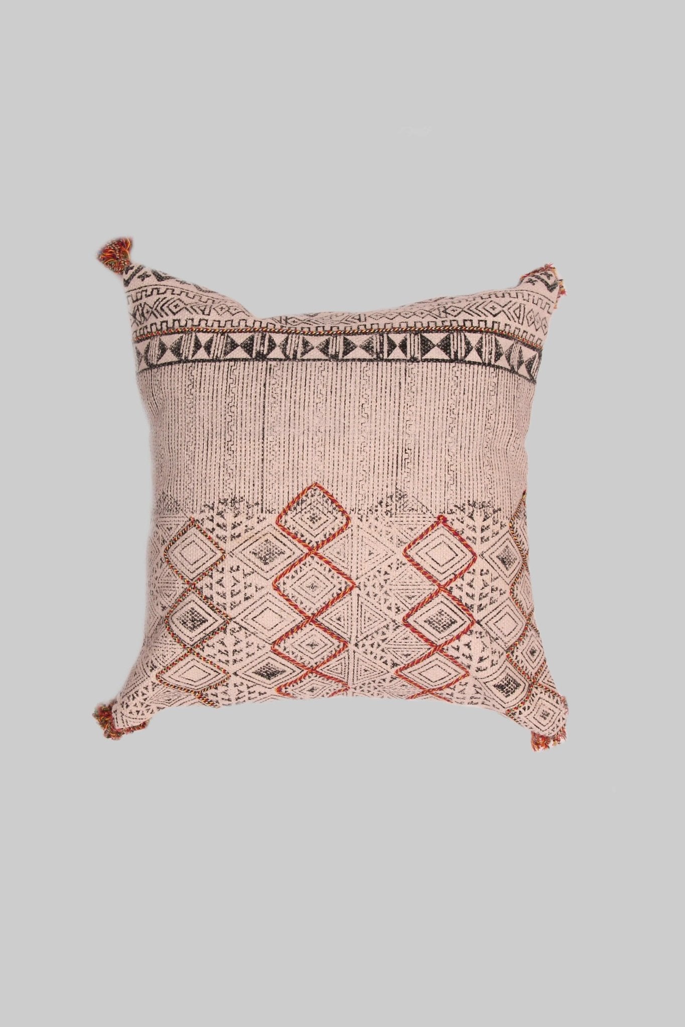 Block-printed square cushion on sofa — Art Avenue