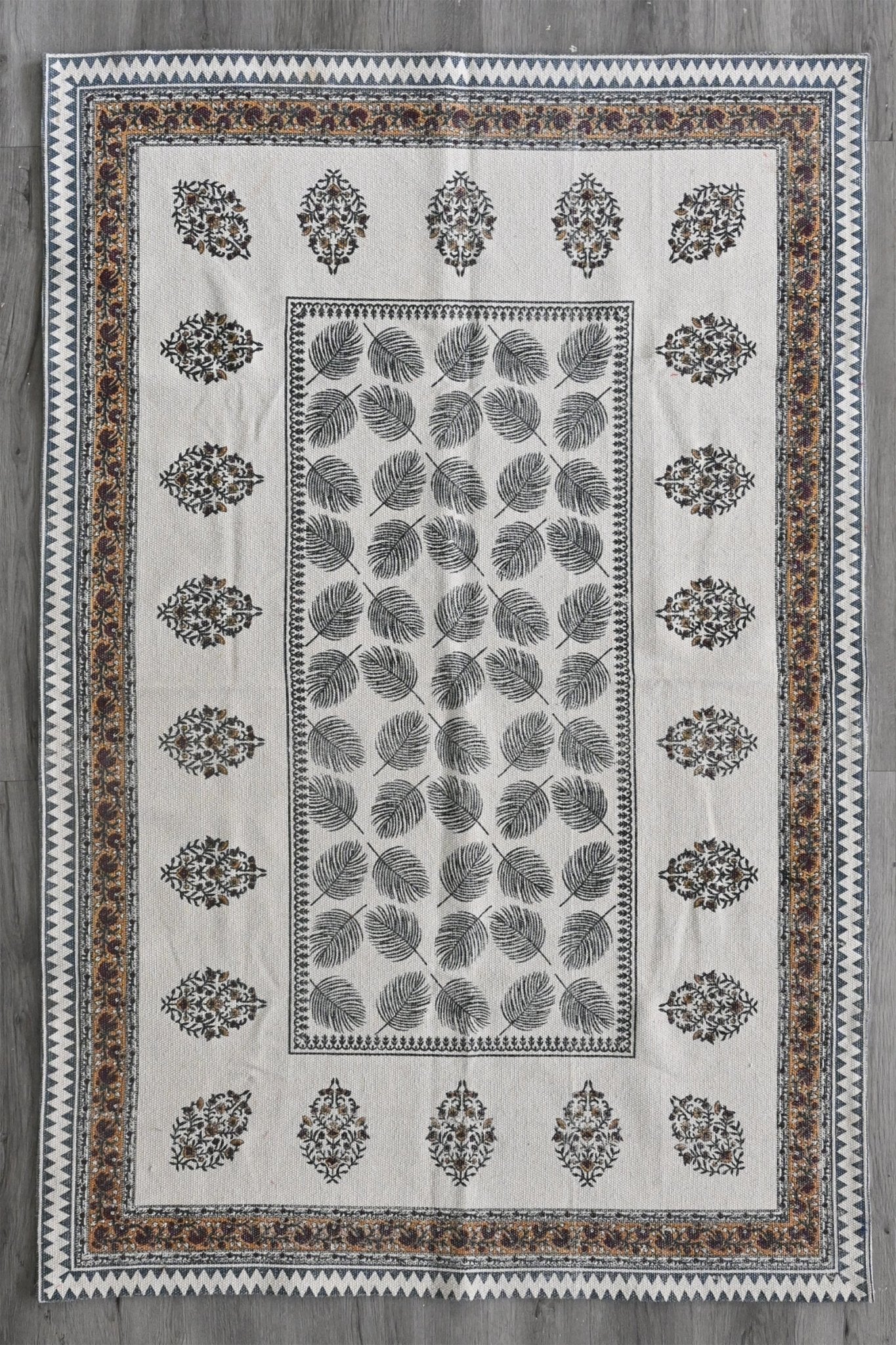 Block-printed cotton dhurrie rug in room setting — Art Avenue
