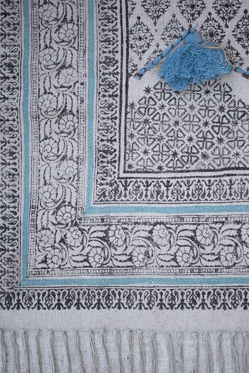 Block-printed cotton dhurrie rug in room setting — Art Avenue