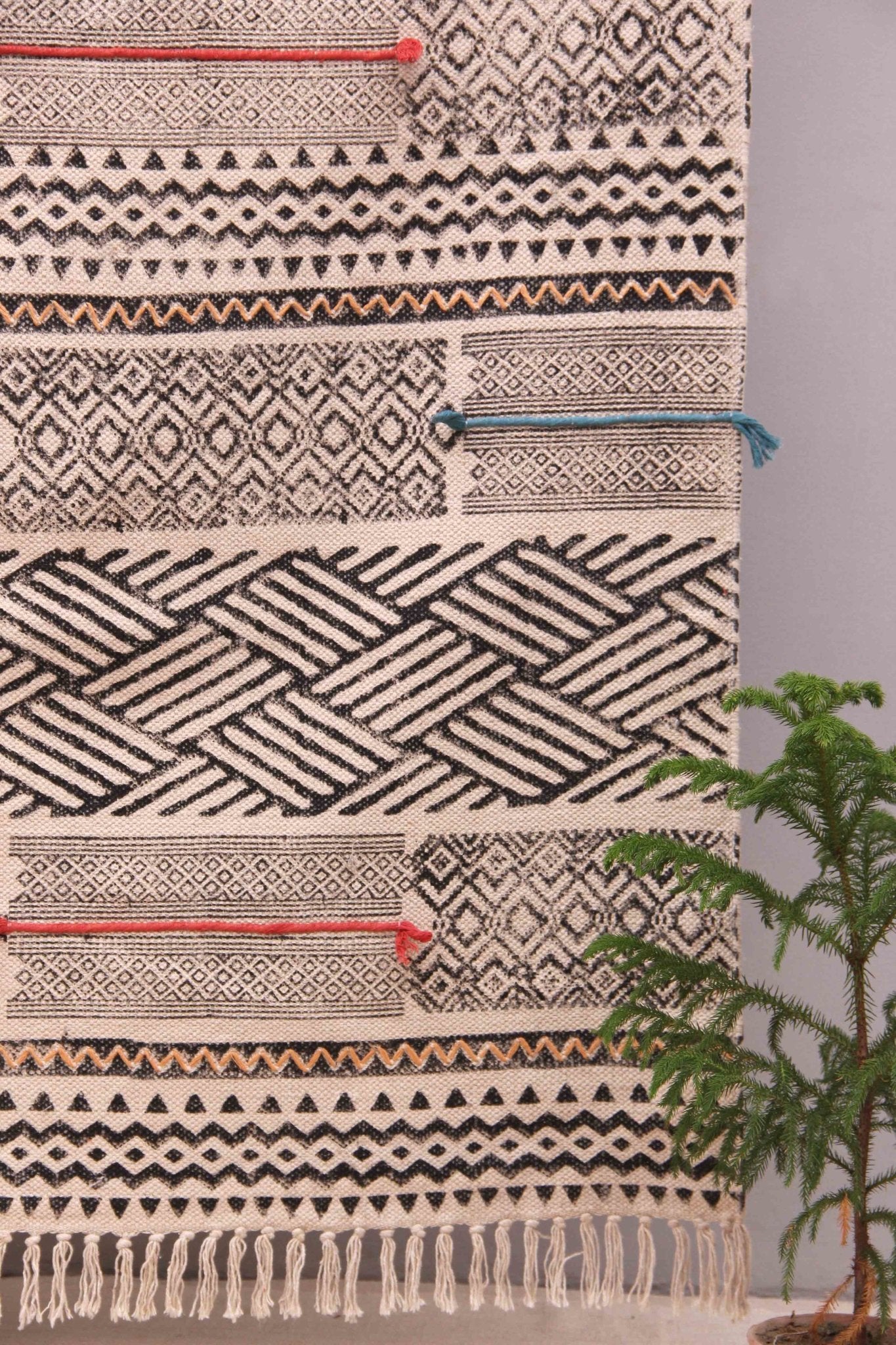 Block-printed cotton dhurrie rug in room setting — Art Avenue