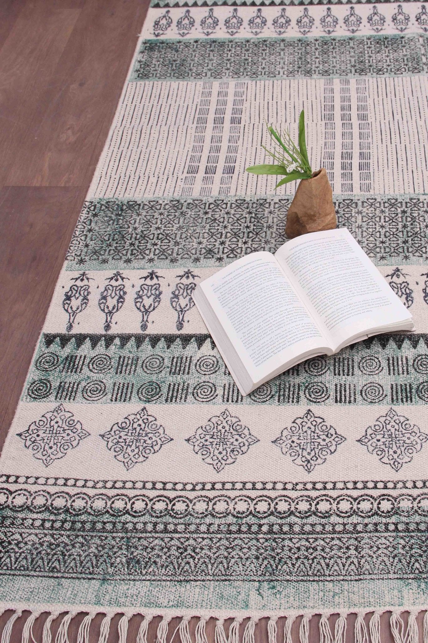 Detail of block-print on green dhurrie rug — Art Avenue
