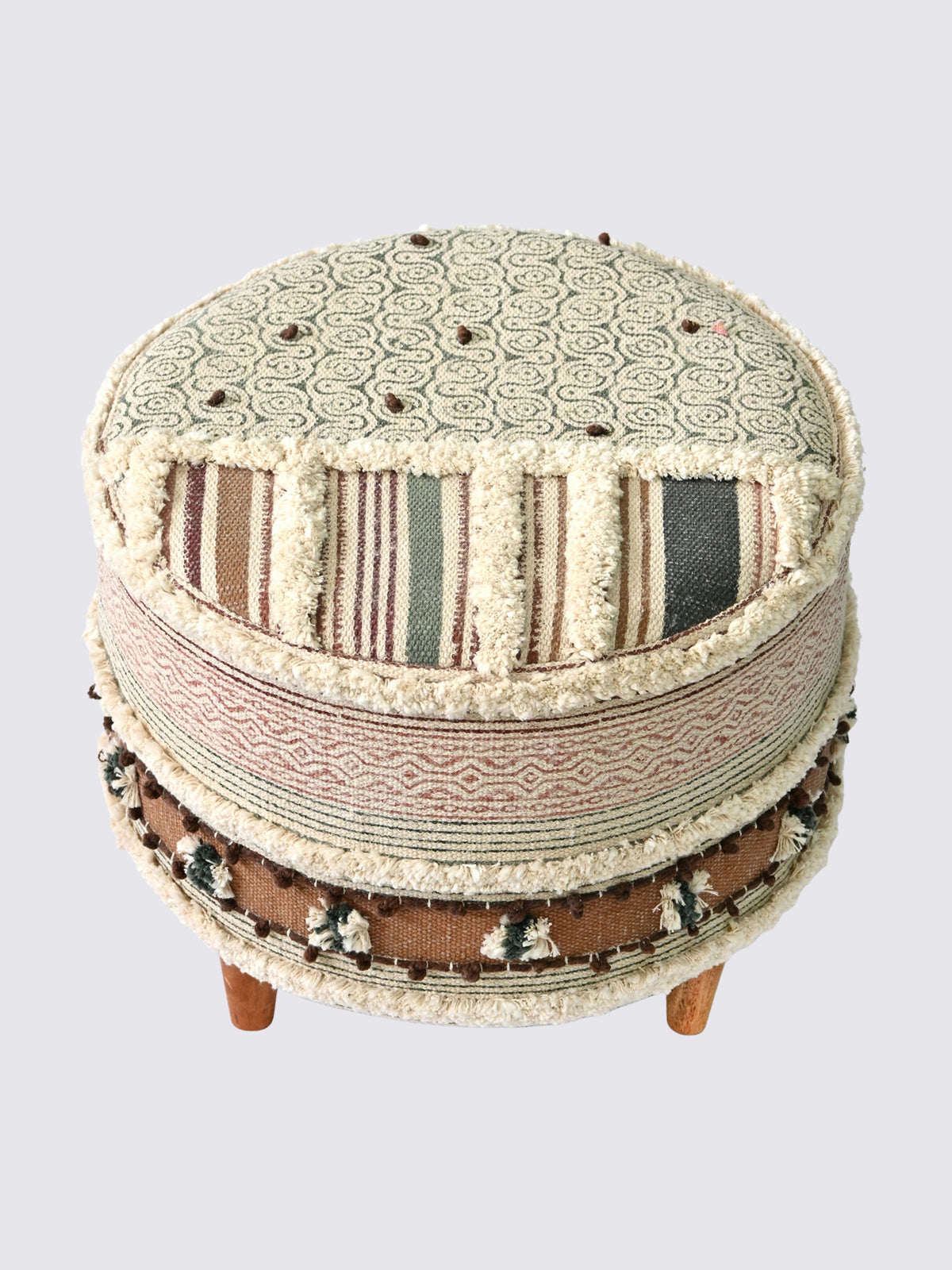 Side view of kilim cylindrical ottoman in brown — Art Avenue