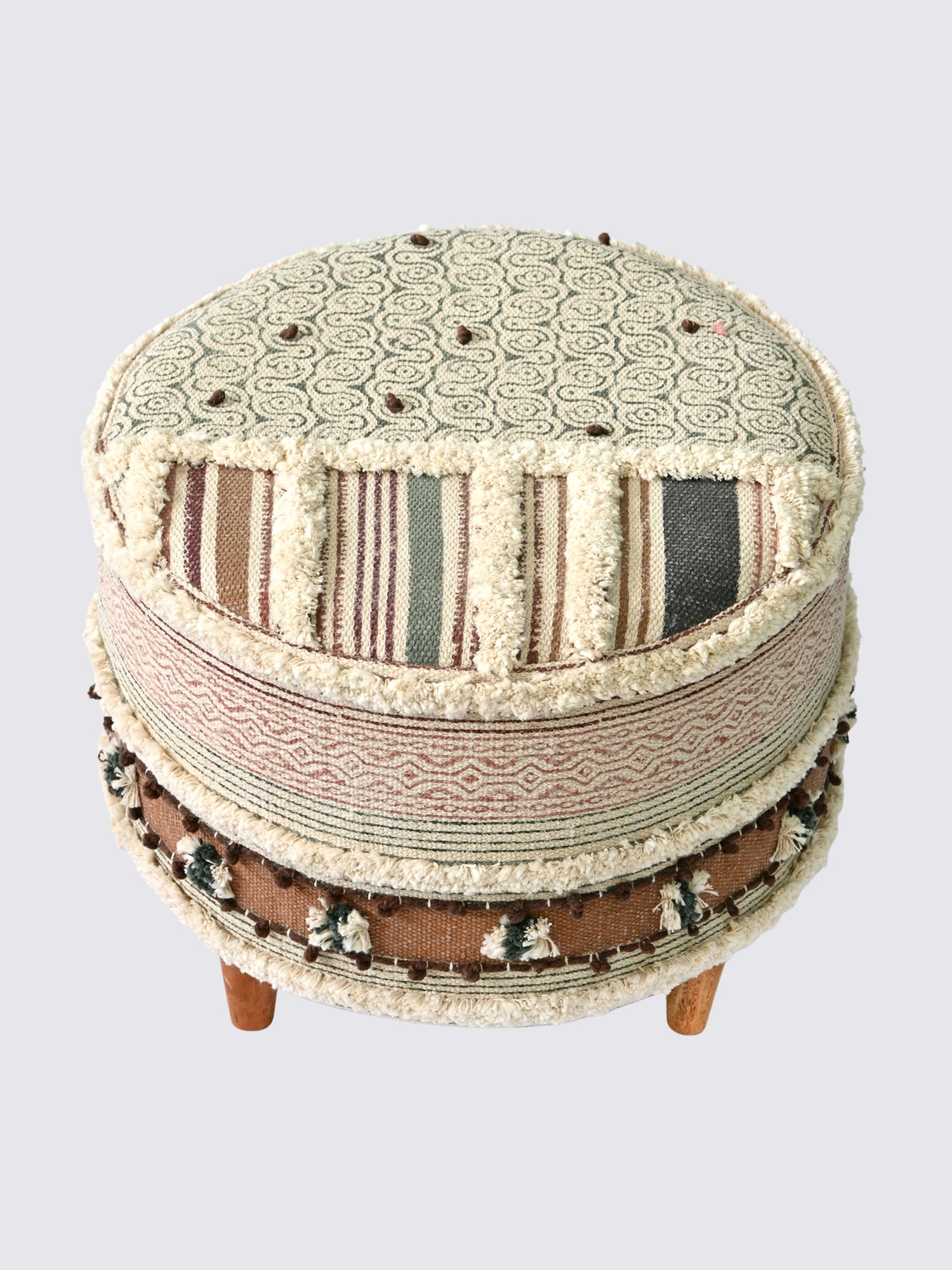Side view of kilim cylindrical ottoman in brown — Art Avenue