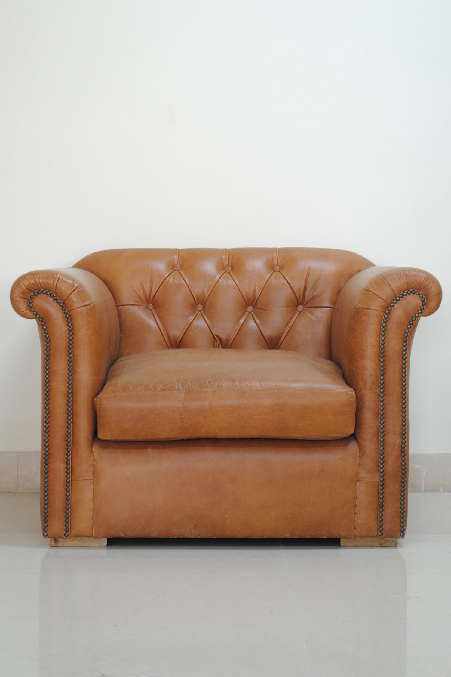 Leather armchair upholstery detail — Art Avenue