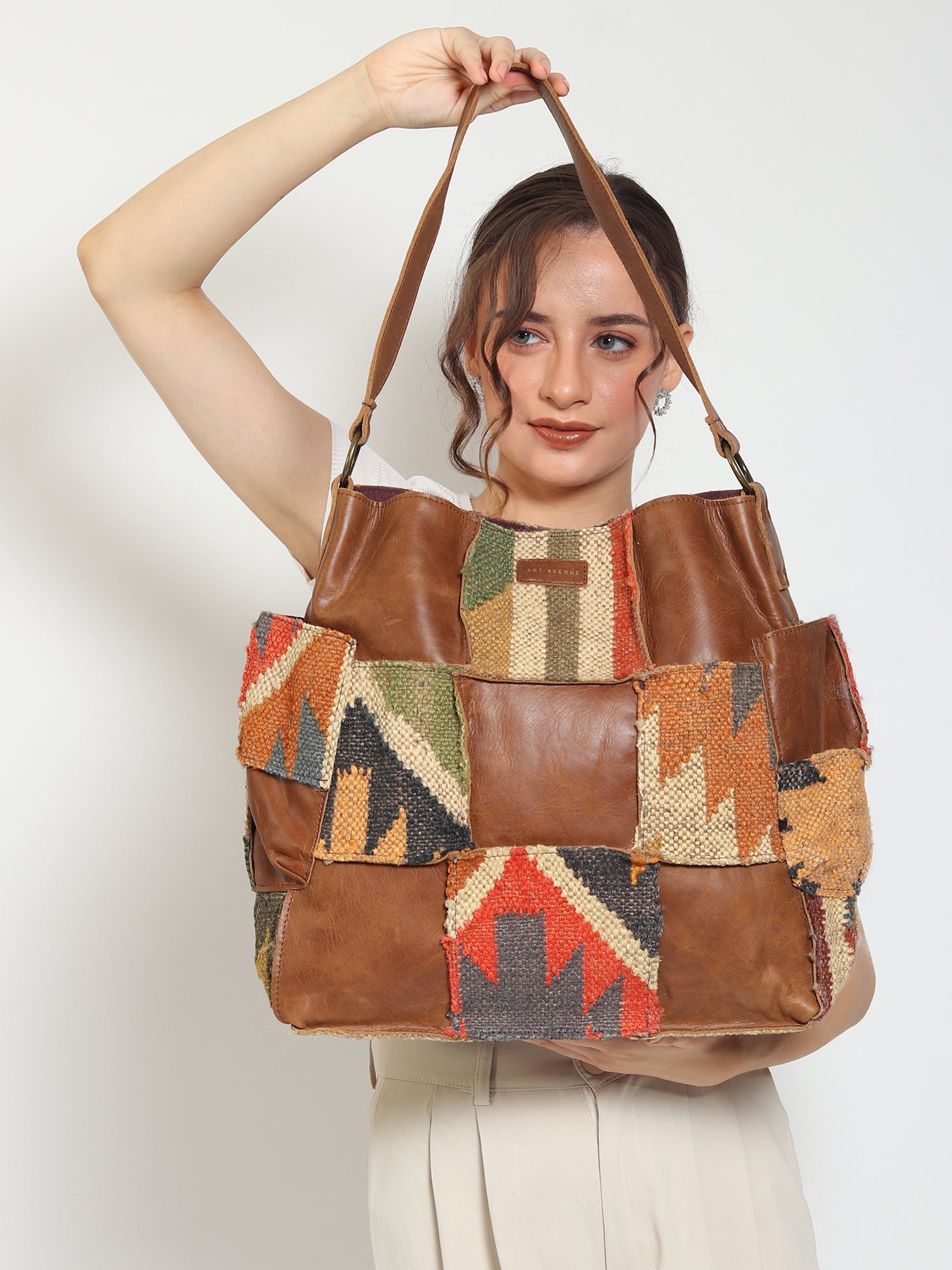 Behoove kilim and leather handbag, side view — Art Avenue