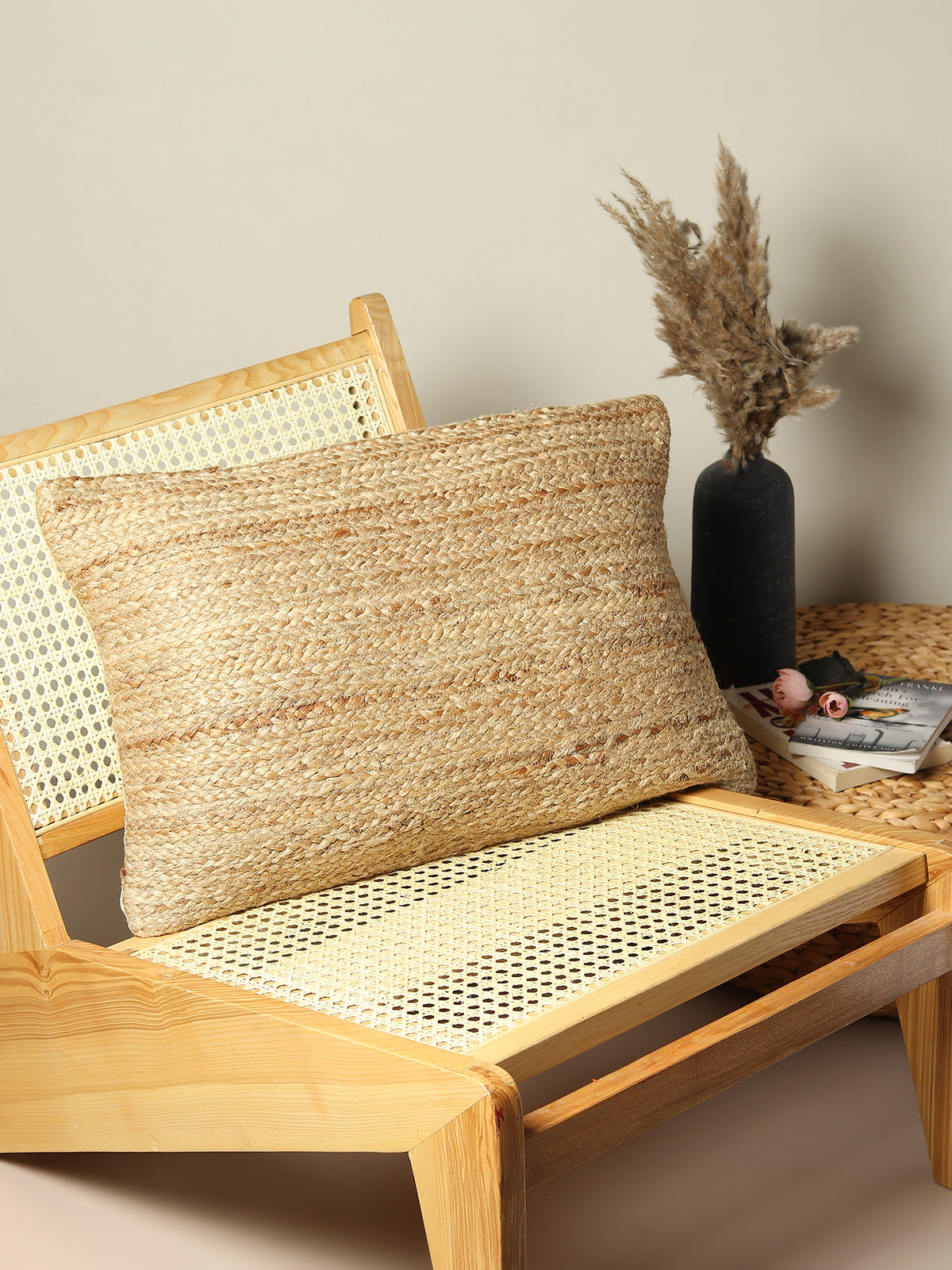 Bellary braided jute lumbar cushion on sofa — Art Avenue India