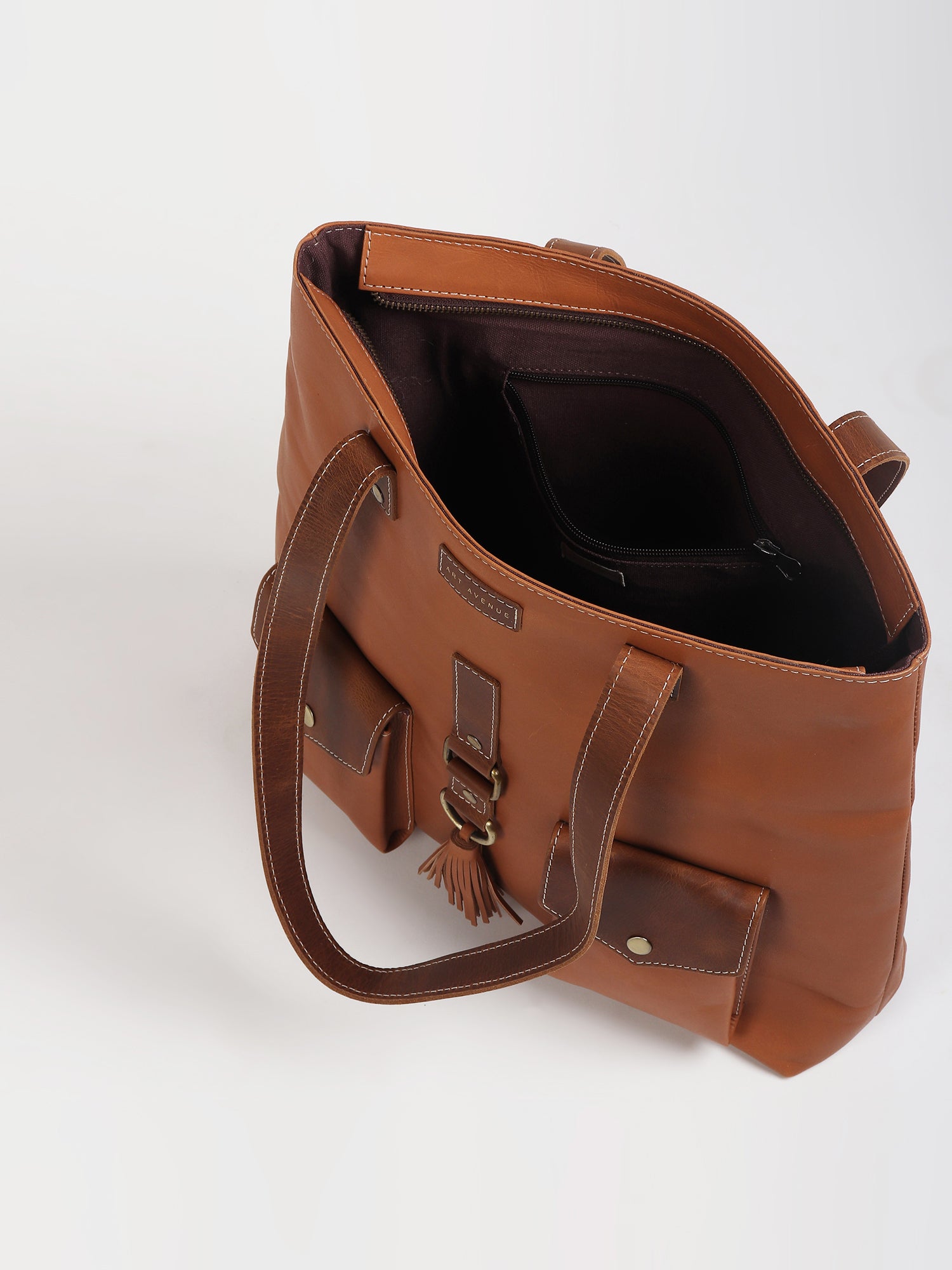 Brawny leather tote bag flat lay — Art Avenue