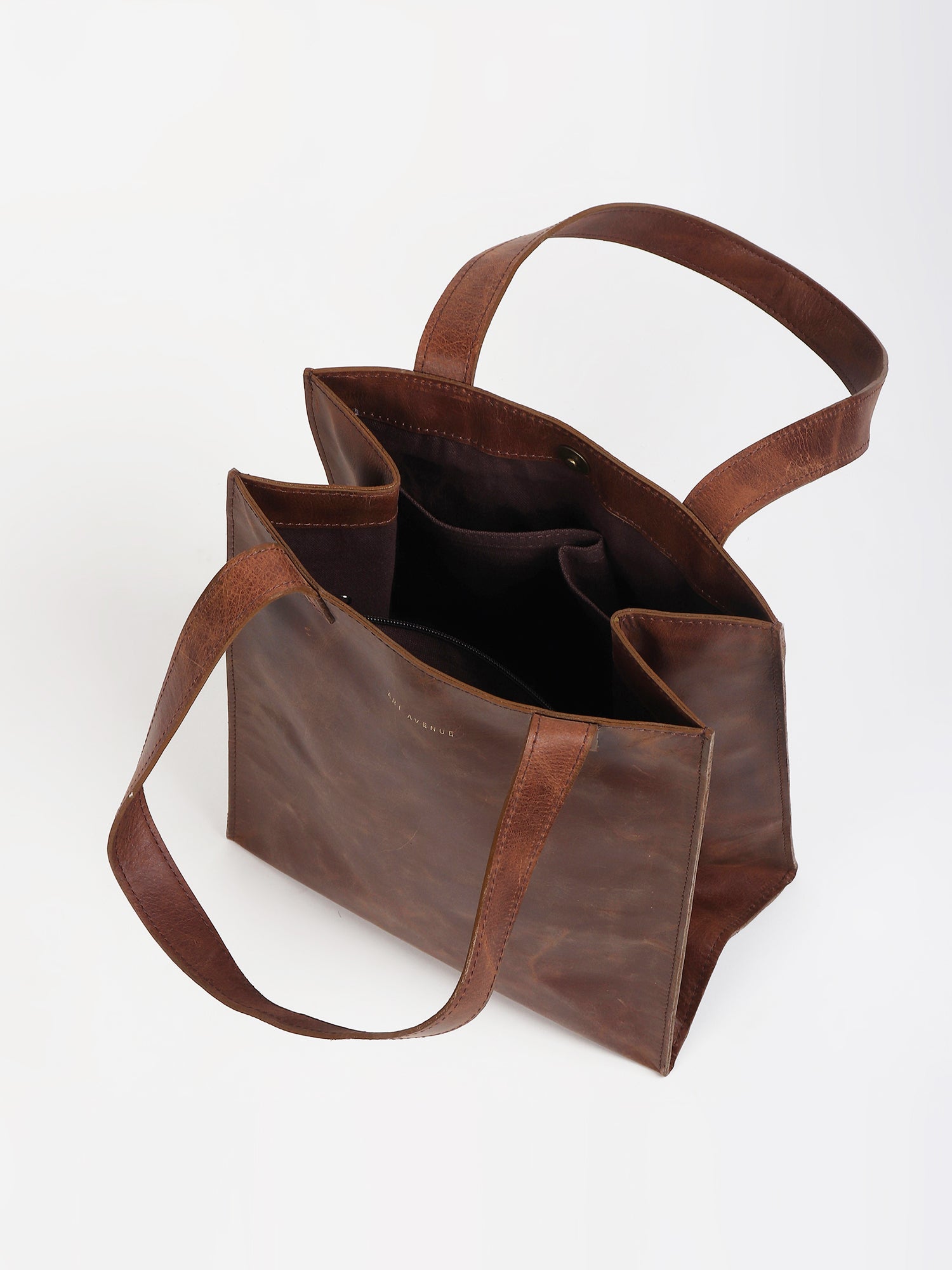Freebie small leather tote bag flat lay — Art Avenue
