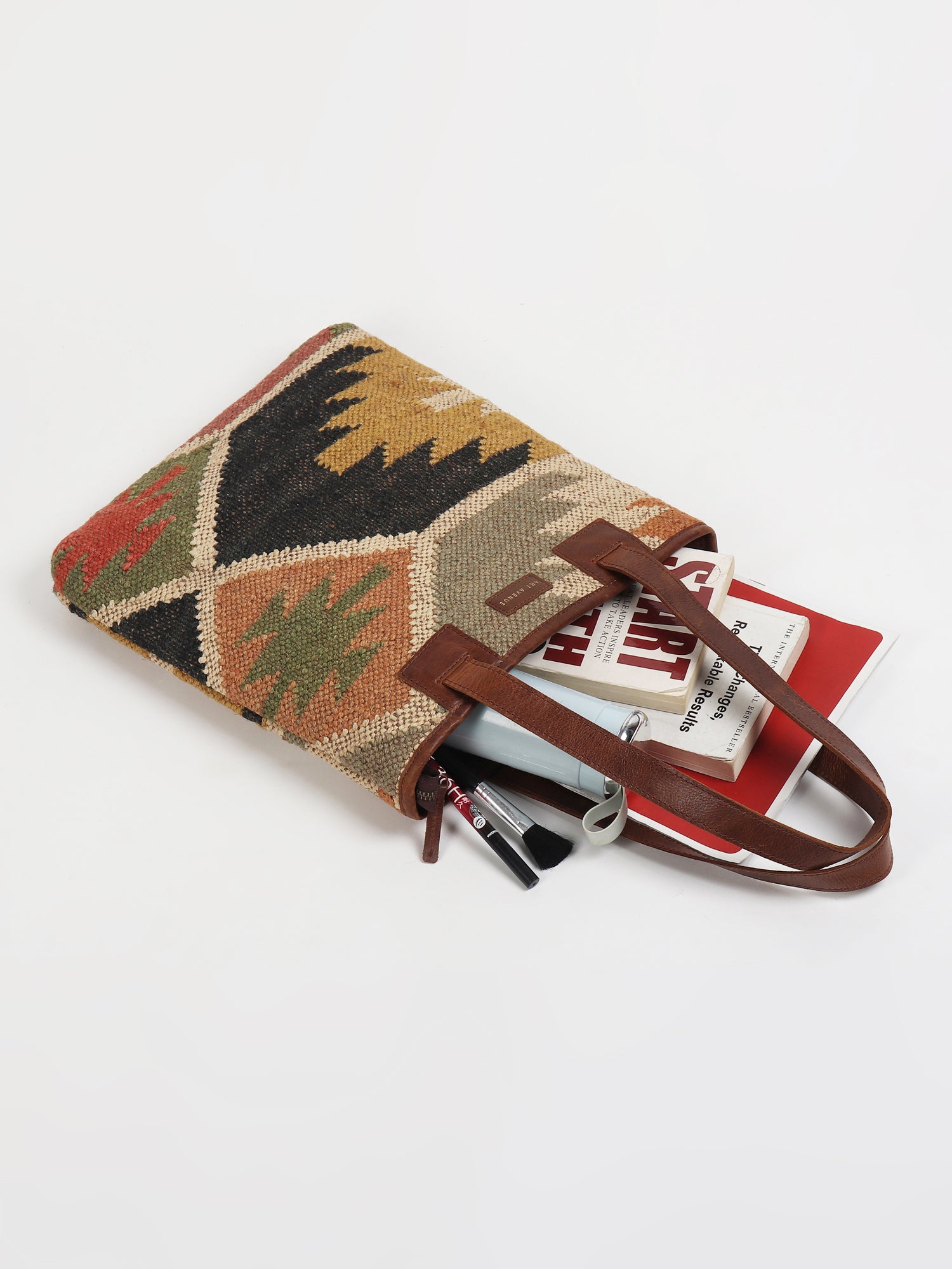 Camelia kilim and leather handbag interior — Art Avenue