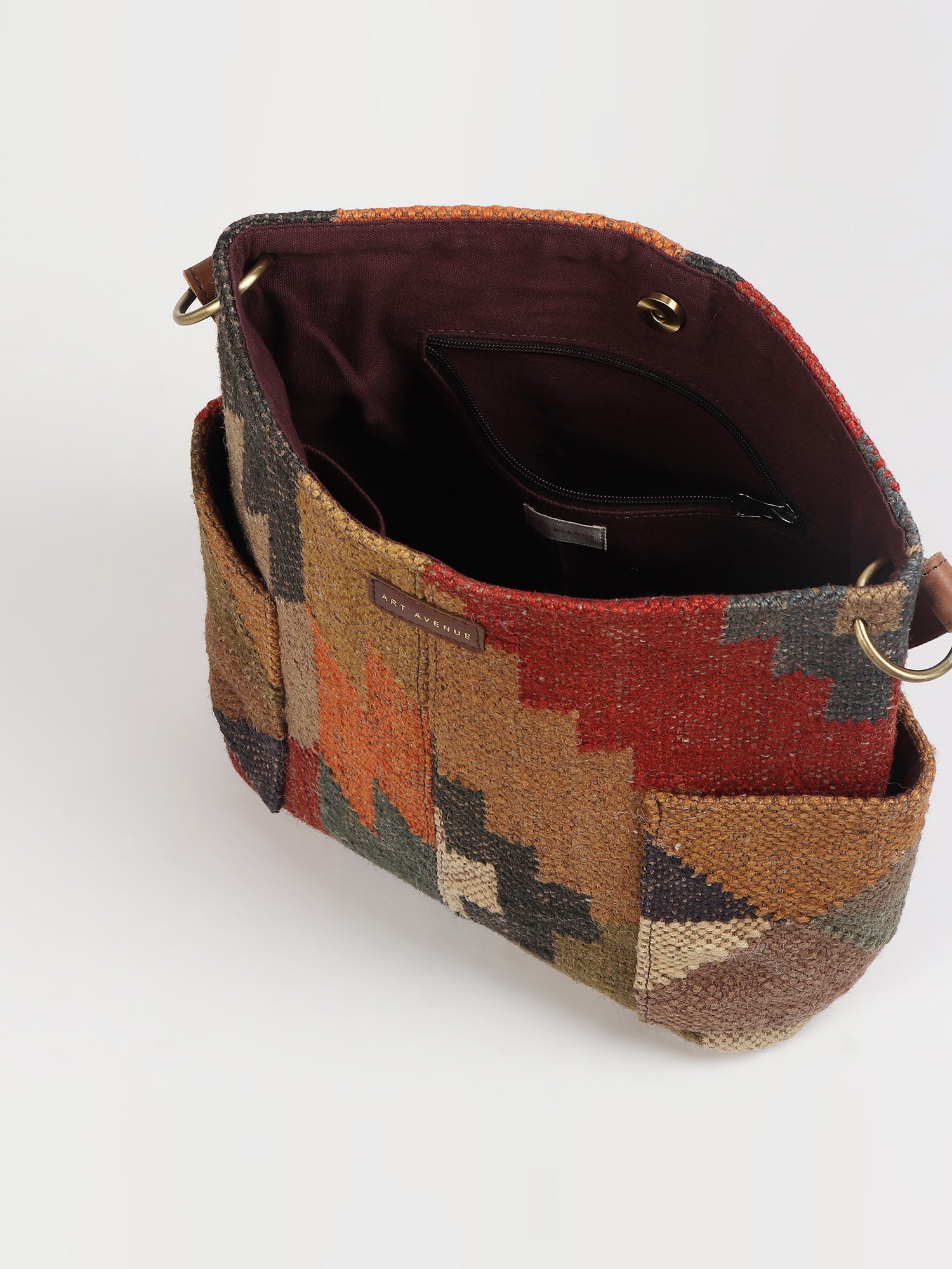 Doodle kilim and leather handbag flat lay — Art Avenue