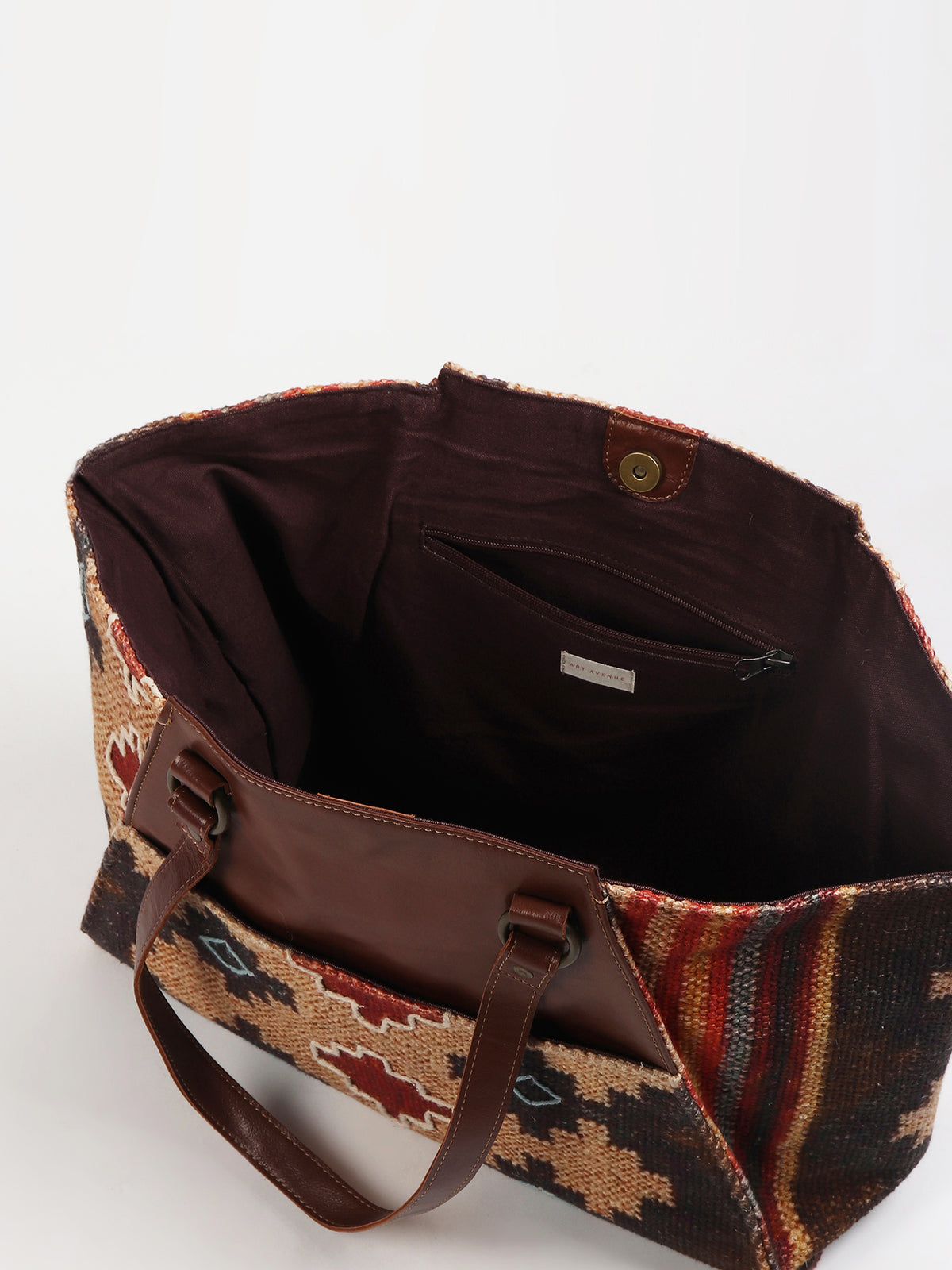 Zemin kilim and leather handbag hardware detail — Art Avenue