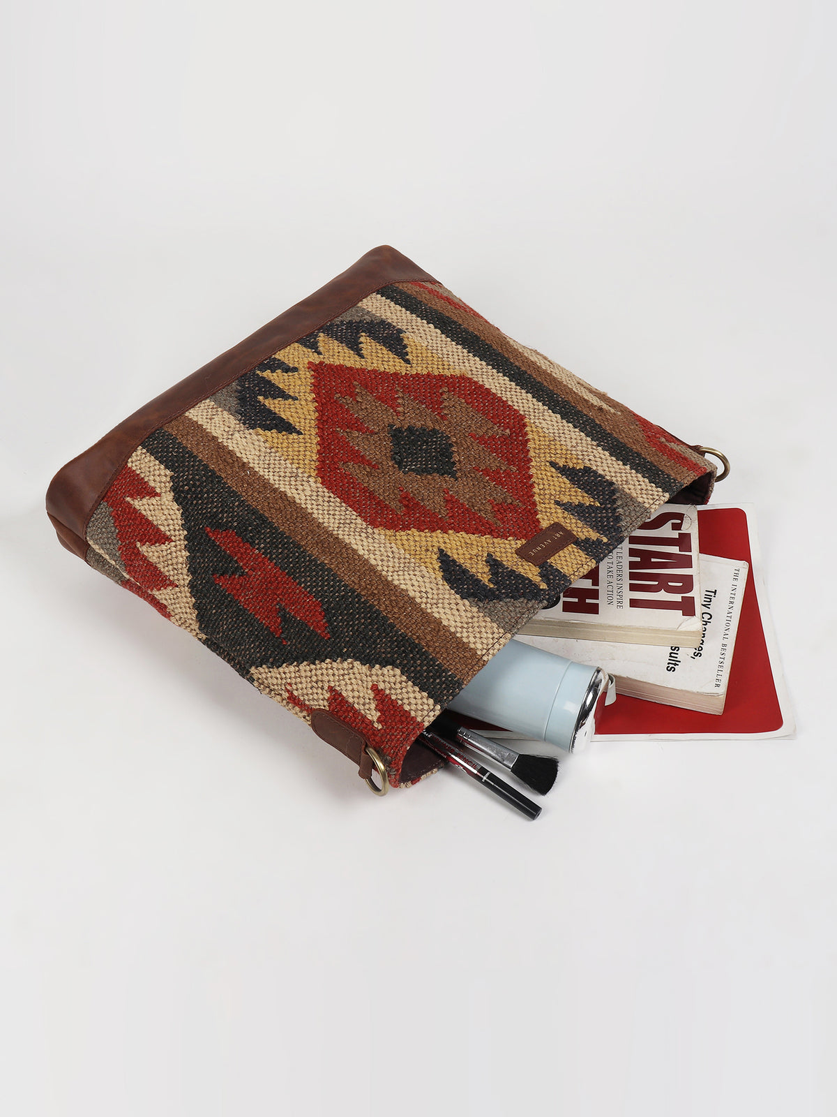 Austere kilim and leather handbag interior — Art Avenue