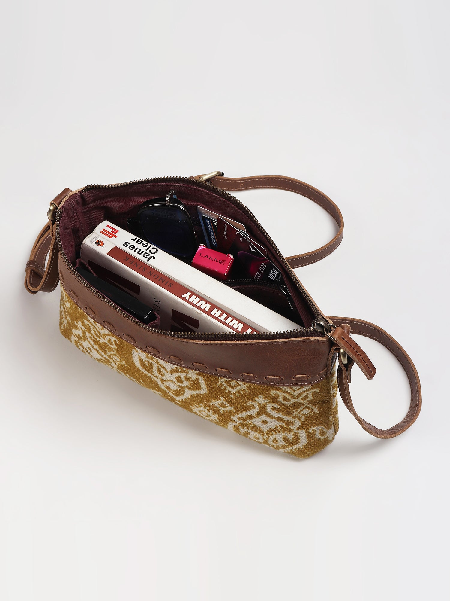 Ayla leather sling bag on model — Art Avenue