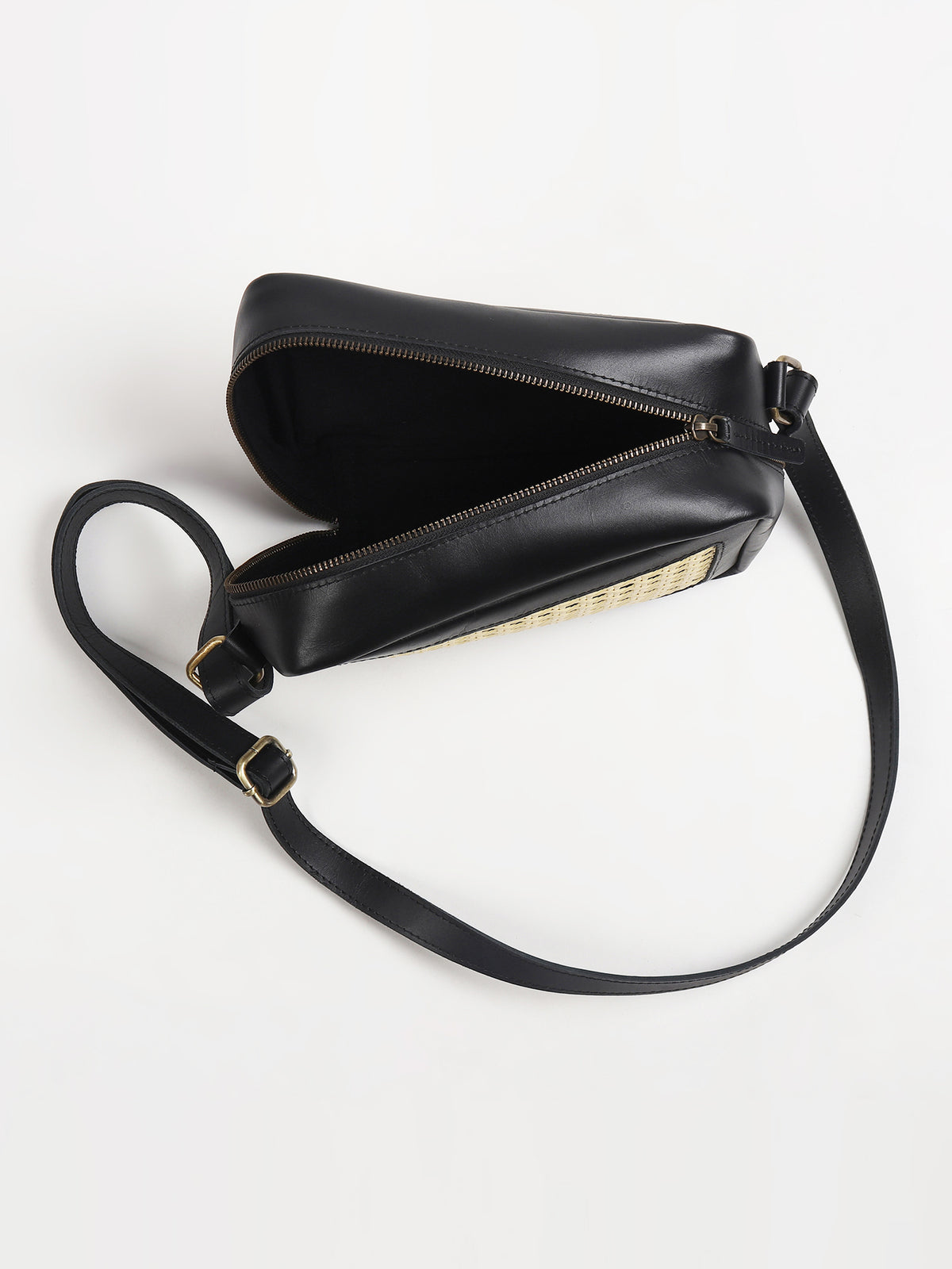 Laremy cane and leather sling bag lifestyle — Art Avenue