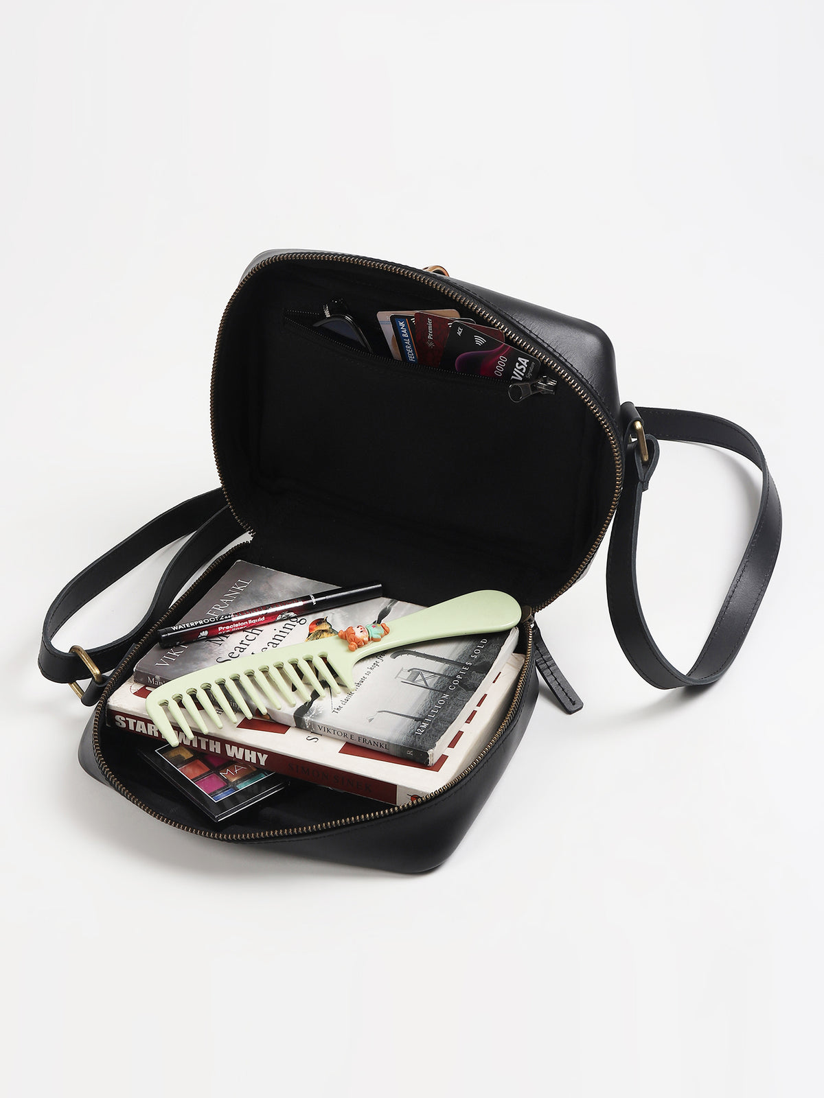 Laremy cane sling bag on model — Art Avenue