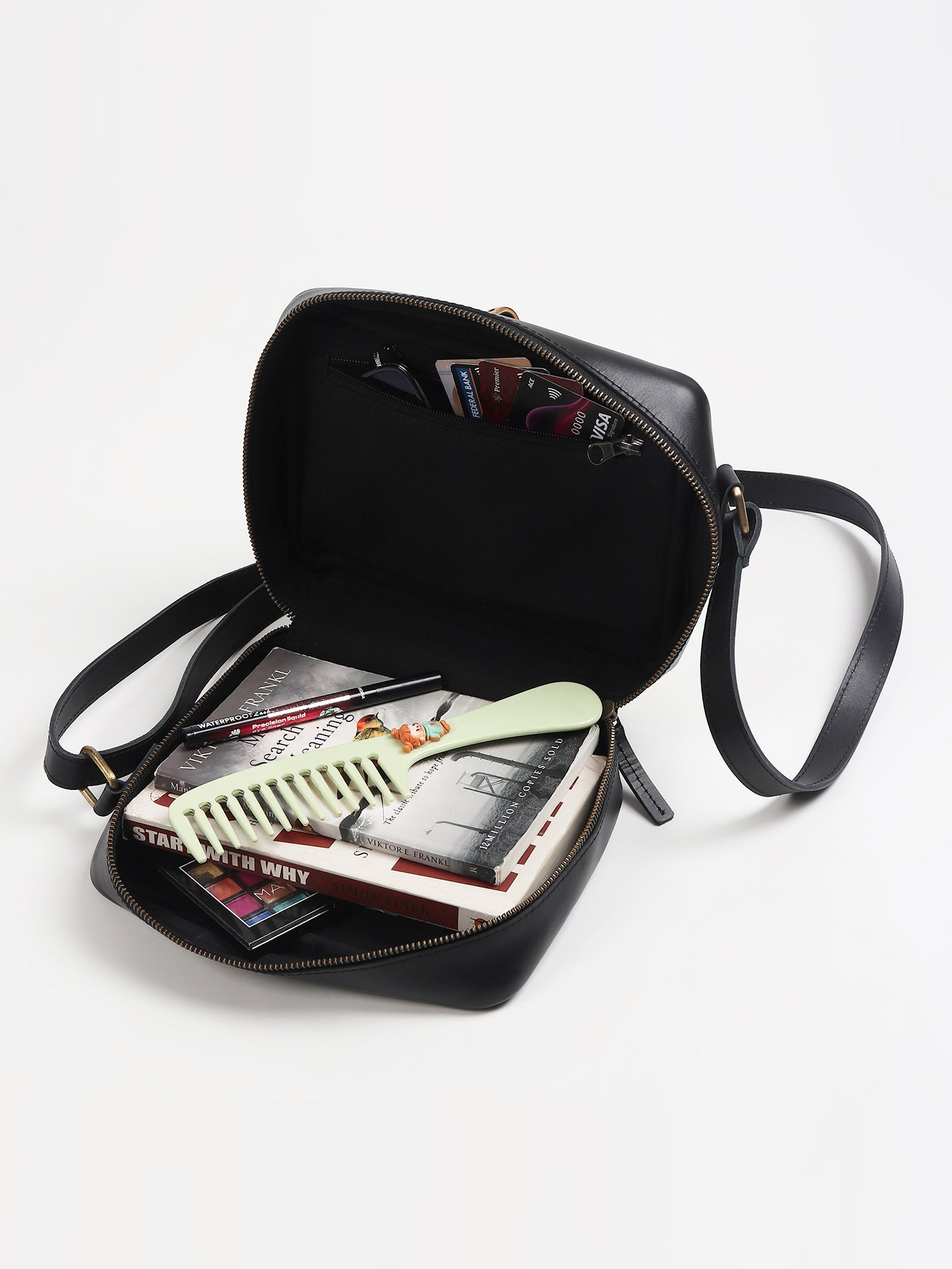 Laremy cane sling bag on model — Art Avenue