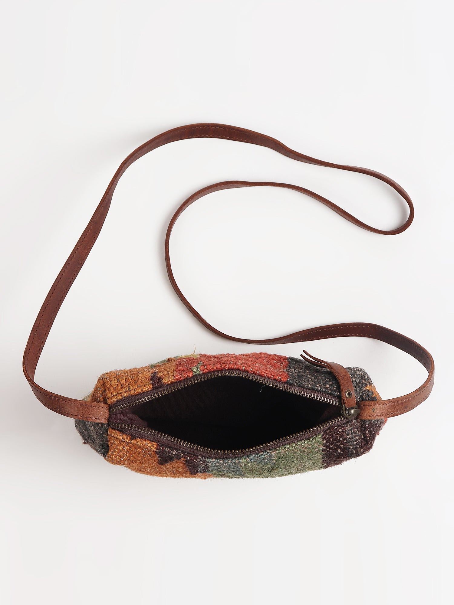 Alpha kilim sling bag on model — Art Avenue