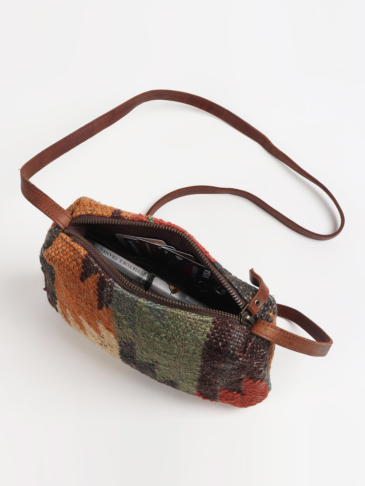 Alpha leather sling bag side detail — Art Avenue
