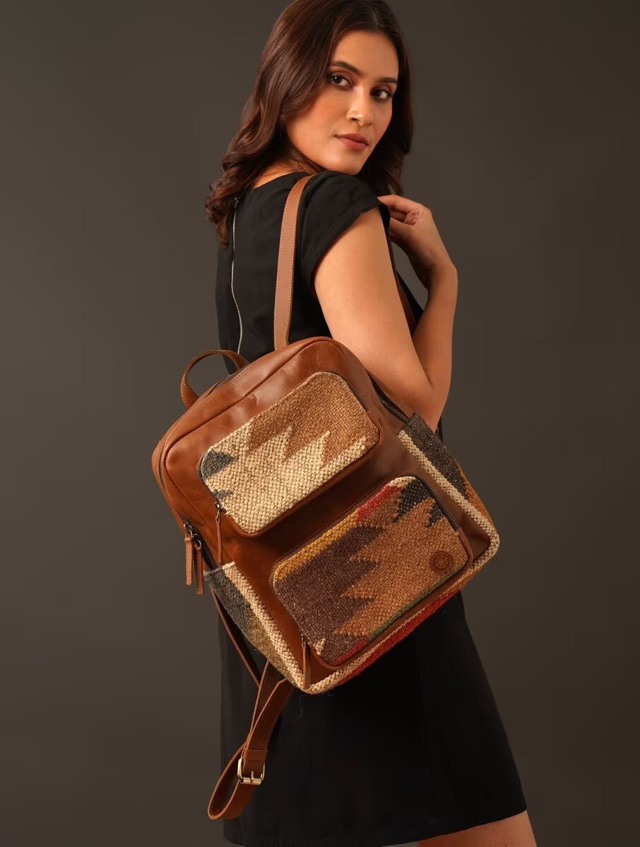 Sabre kilim and leather backpack, side view — Art Avenue