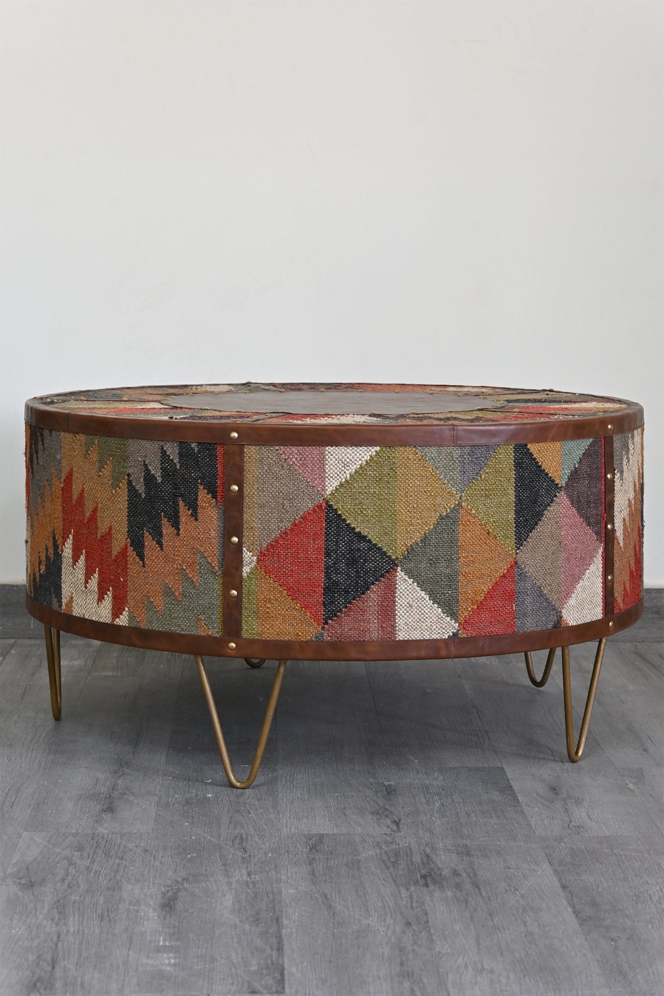 Goround kilim coffee table — kilim upholstered top — Art Avenue