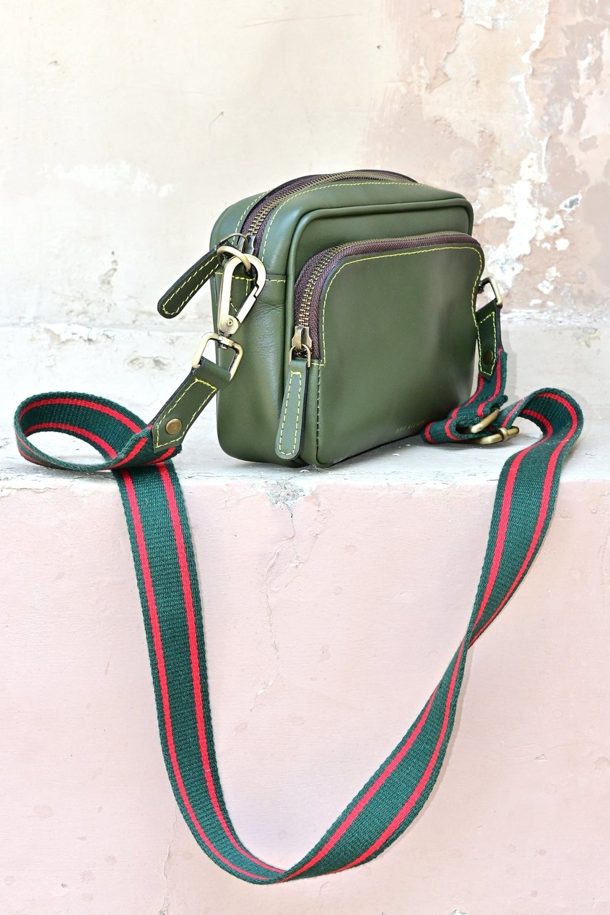Harisson leather sling bag in green, second view — Art Avenue
