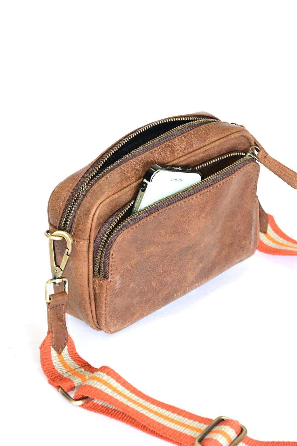 Harisson brown sling bag on model — Art Avenue