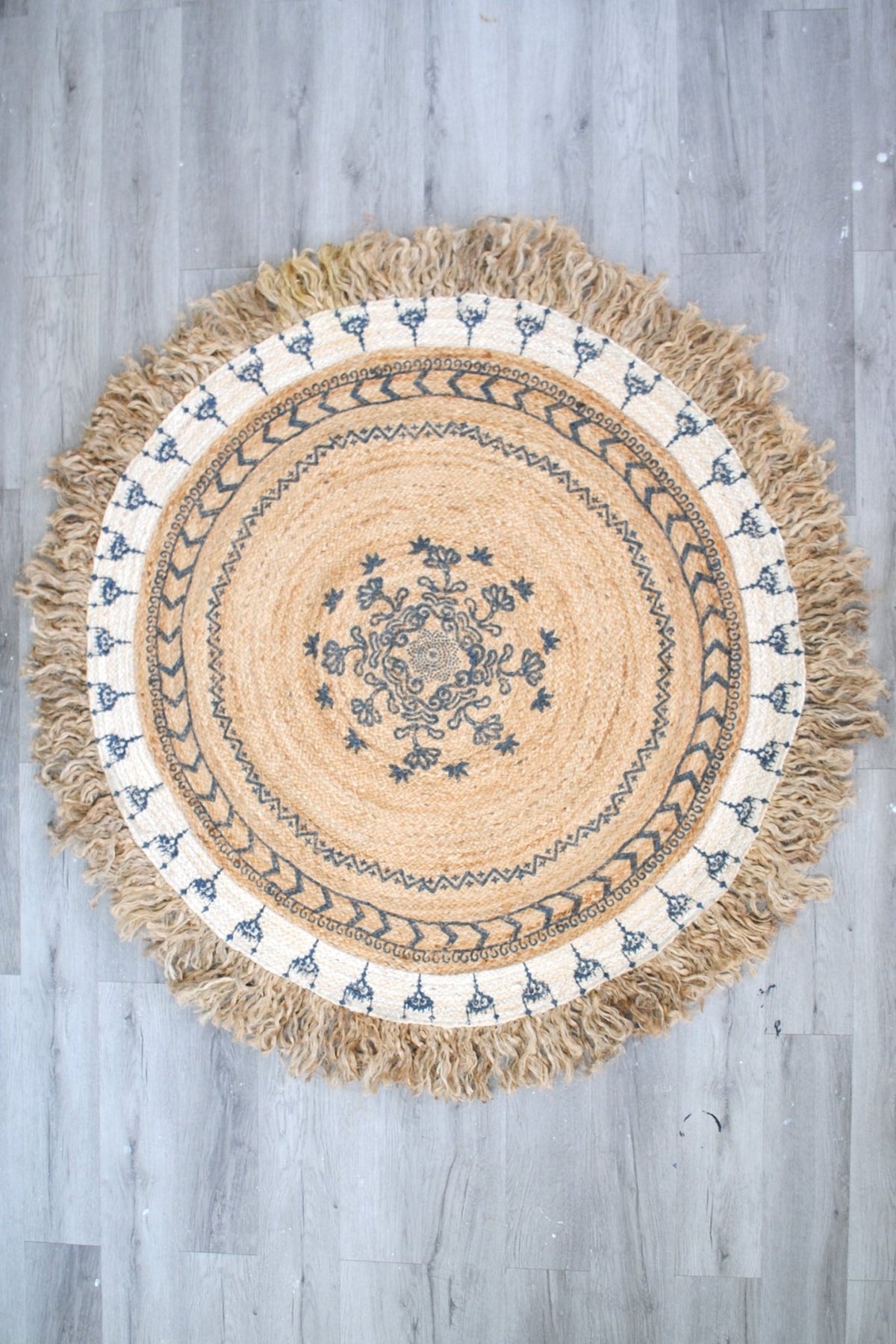 Niello round jute rug room setting — Art Avenue India