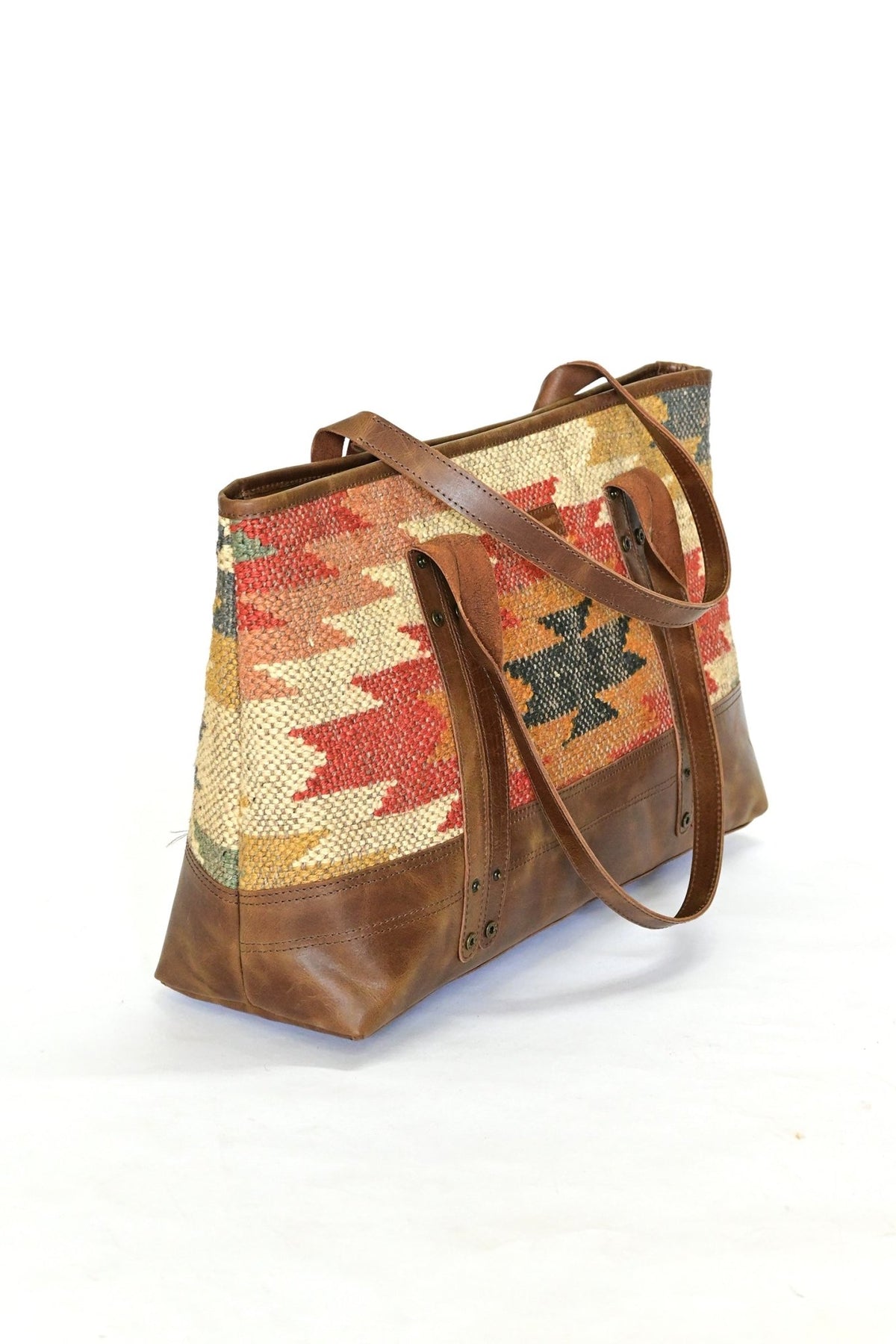 Alpine kilim and leather handbag, side view — Art Avenue