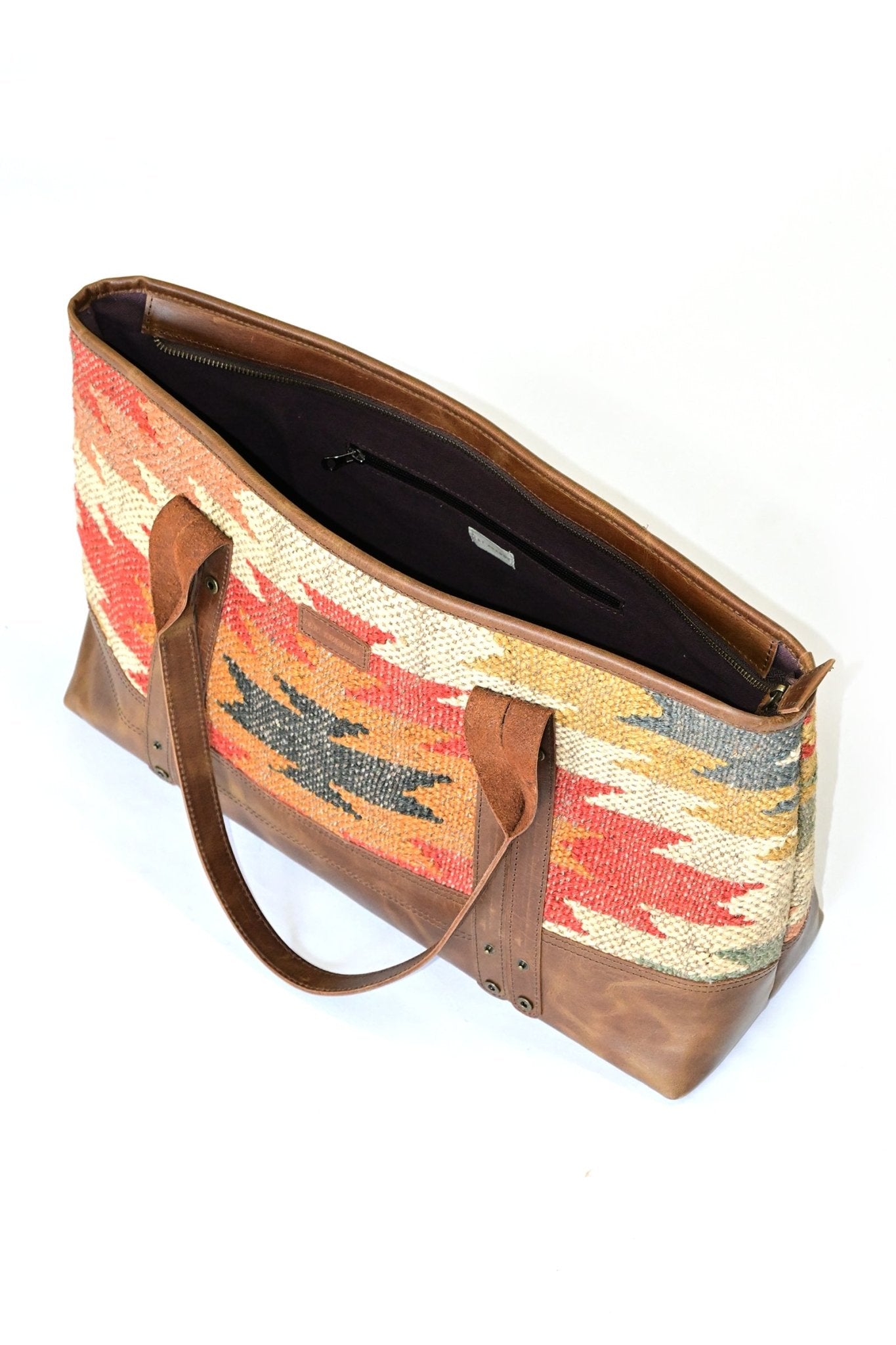 Alpine kilim and leather handbag lifestyle — Art Avenue