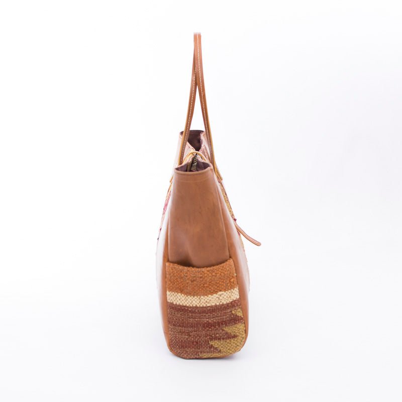 Trevor kilim and leather handbag flat lay — Art Avenue