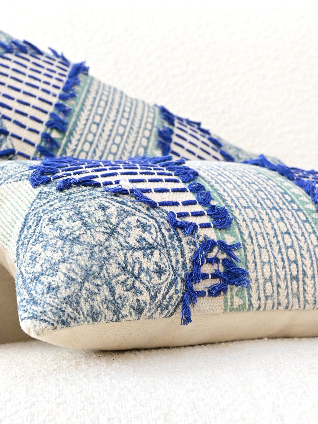 Block-printed embroidered lumbar cushion on sofa — Art Avenue